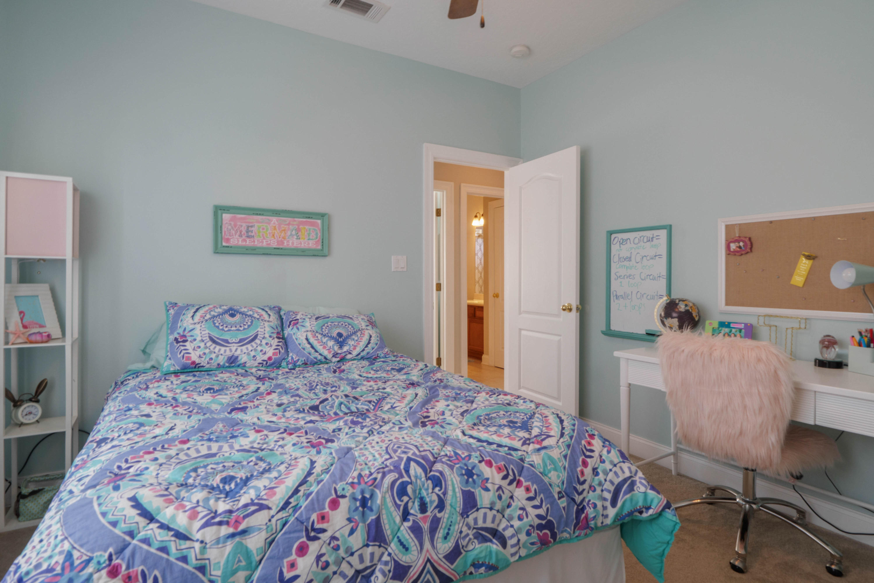 4611 Chanan Drive Crestview, FL 32539 - Photo 32 of 39 a bedroom with a bed and a dresser in it