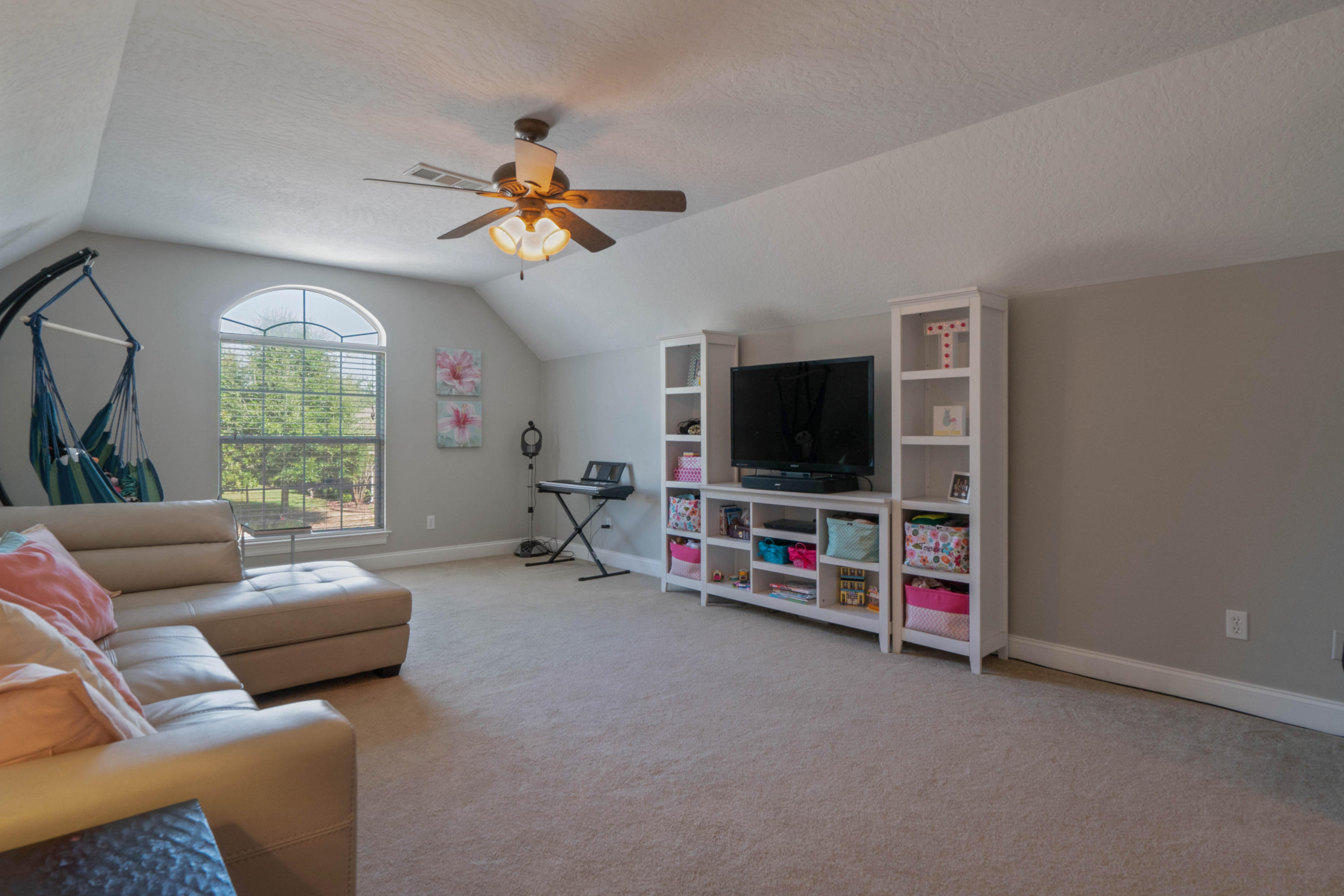 4611 Chanan Drive Crestview, FL 32539 - Photo 33 of 39 a living room with furniture and a flat screen tv