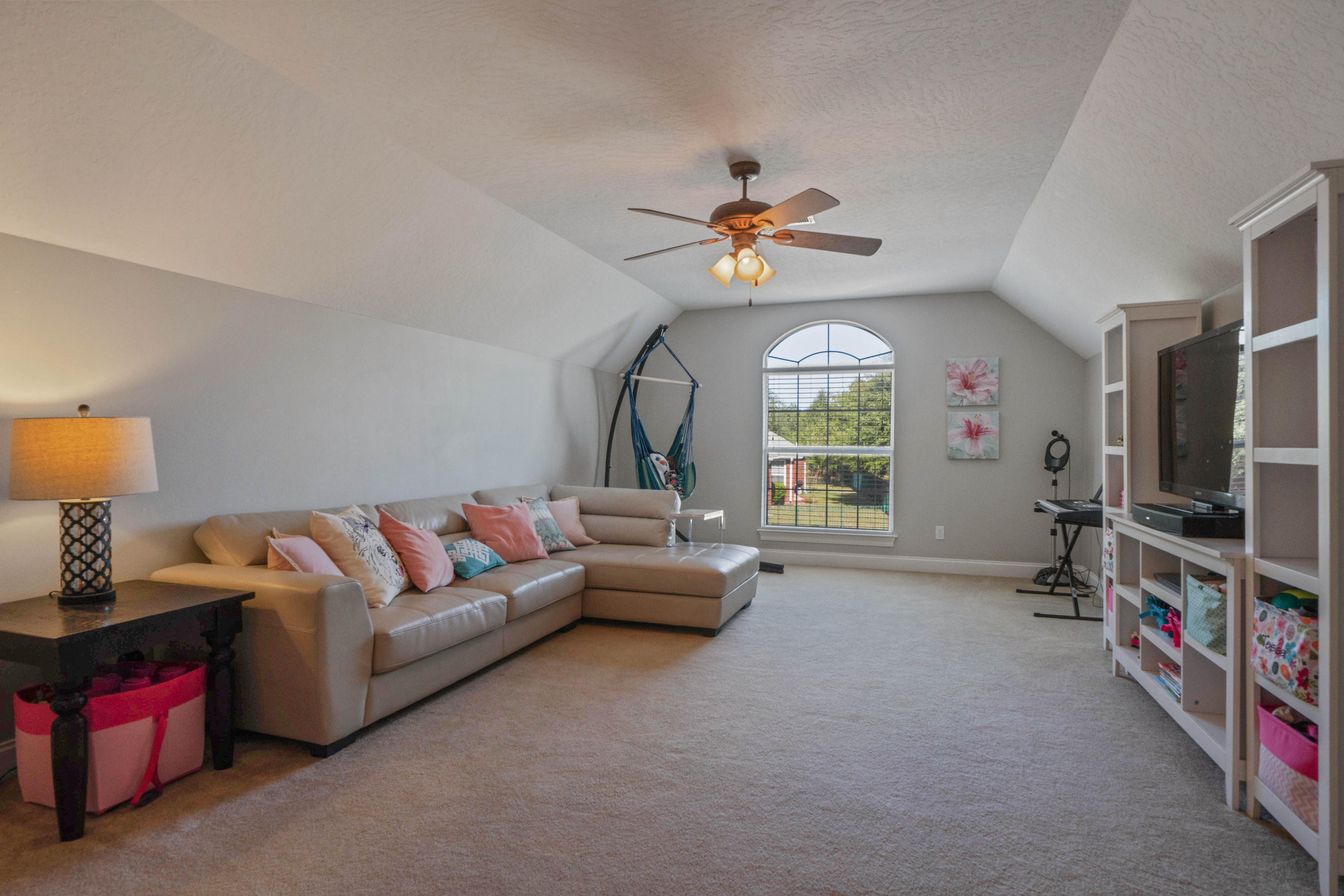 4611 Chanan Drive Crestview, FL 32539 - Photo 34 of 39 a living room with furniture a flat screen tv and a window