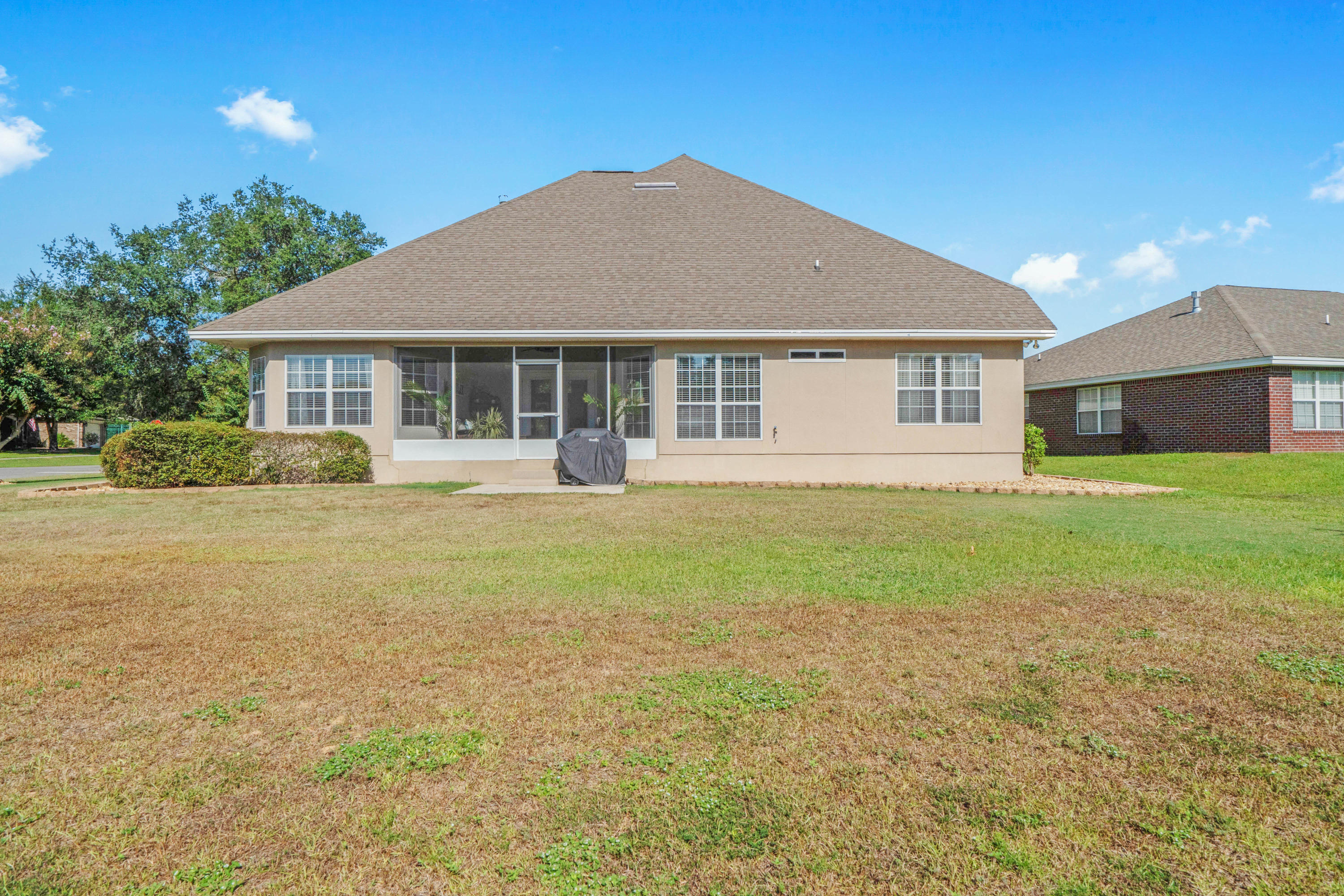 4611 Chanan Drive Crestview, FL 32539 - Photo 4 of 39 a view of a house with a yard