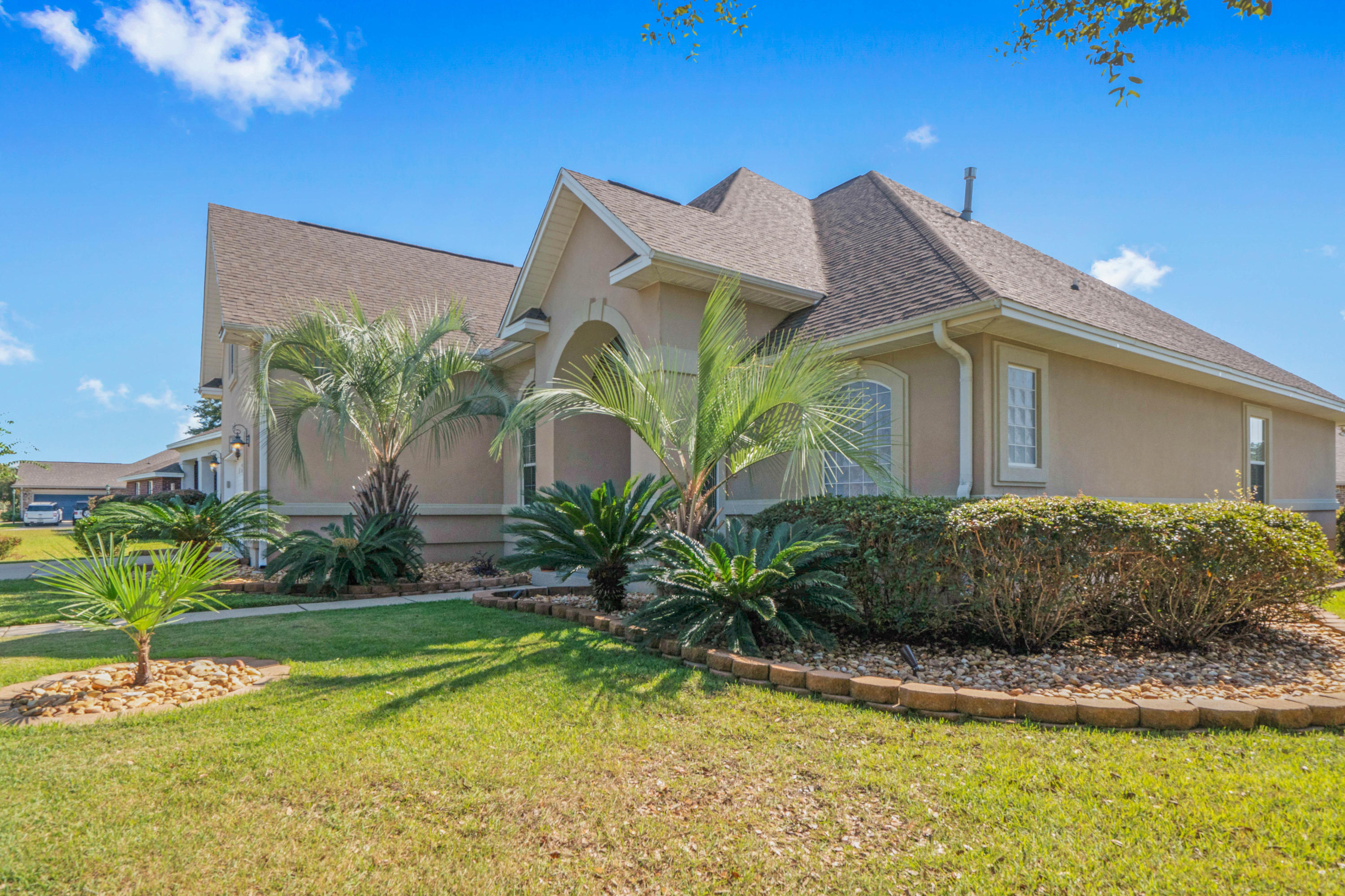 4611 Chanan Drive Crestview, FL 32539 - Photo 7 of 39 a front view of a house with garden