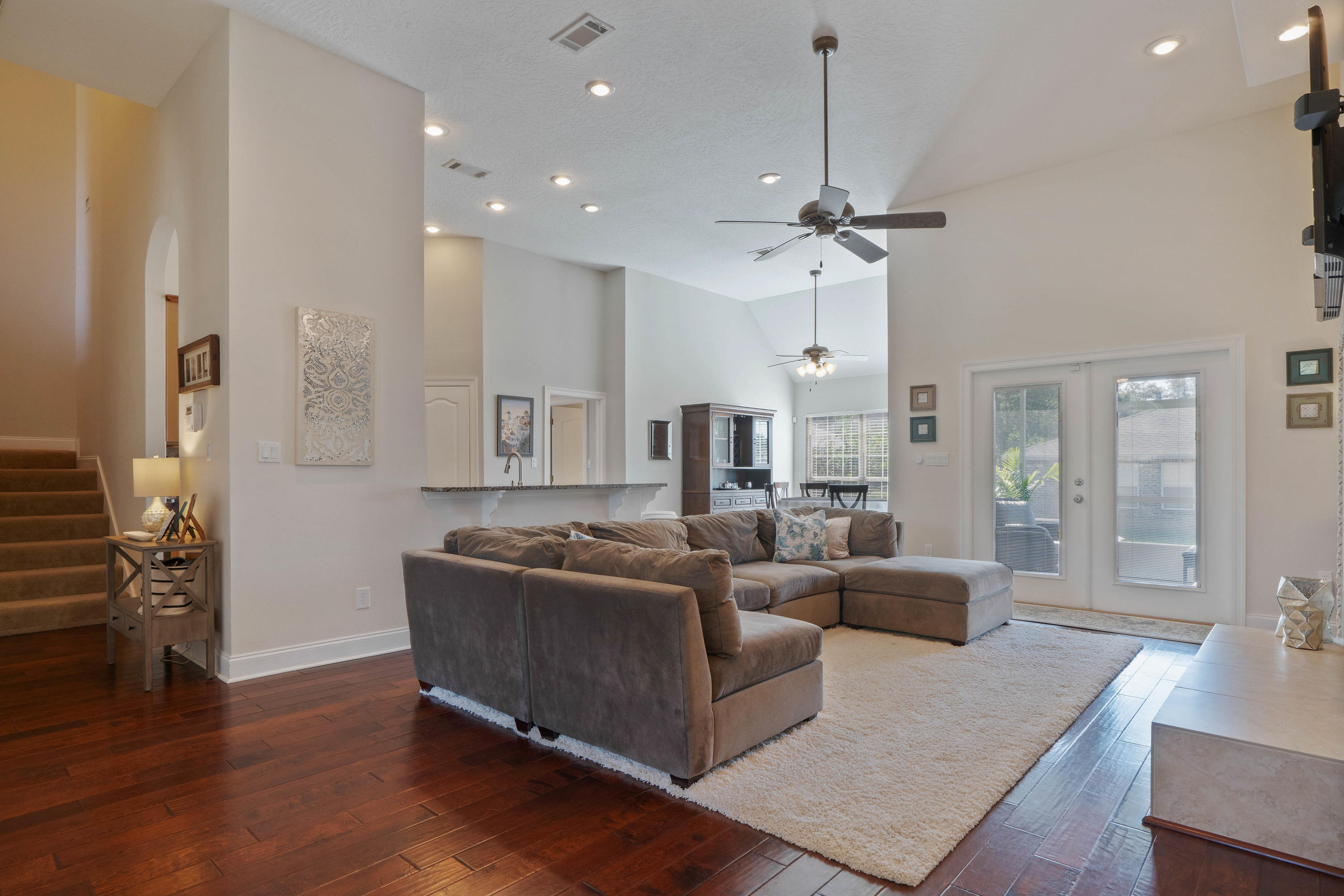 4611 Chanan Drive Crestview, FL 32539 - Photo 10 of 39 a living room with furniture and a chandelier