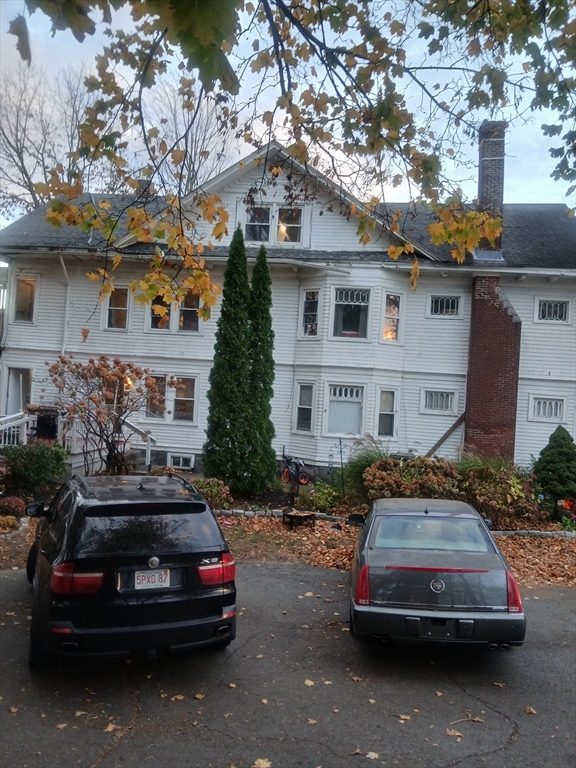 156 Summer Street Fitchburg, MA 01420 - Photo 6 of 36 a car parked in front of a house