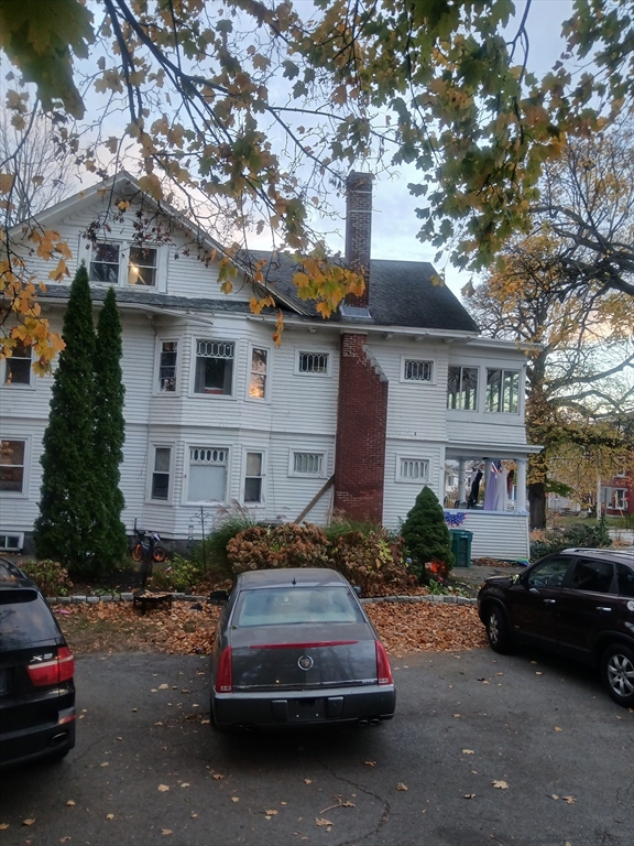 156 Summer Street Fitchburg, MA 01420 - Photo 7 of 36 a car parked in front of a house