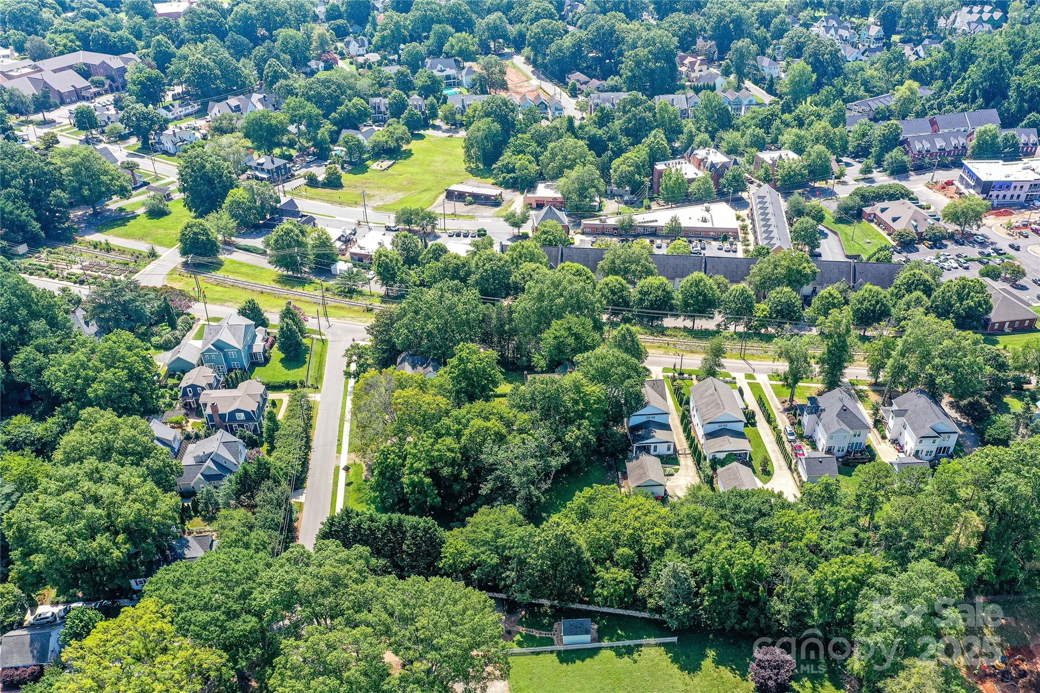 504 Potts Street Davidson, NC 28036 - Photo 13 of 34 an aerial view of residential houses with outdoor space and swimming pool
