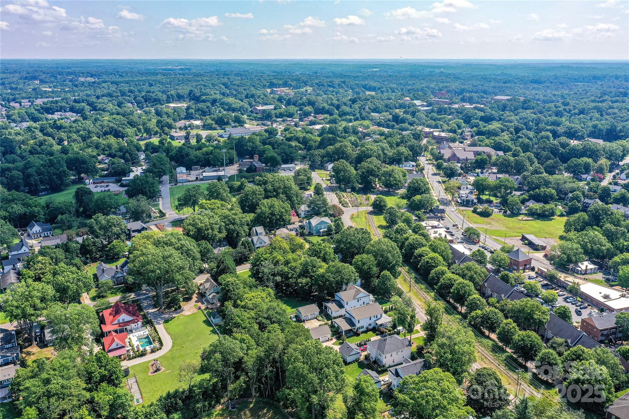 504 Potts Street Davidson, NC 28036 - Photo 17 of 34 an aerial view of residential houses with outdoor space and trees