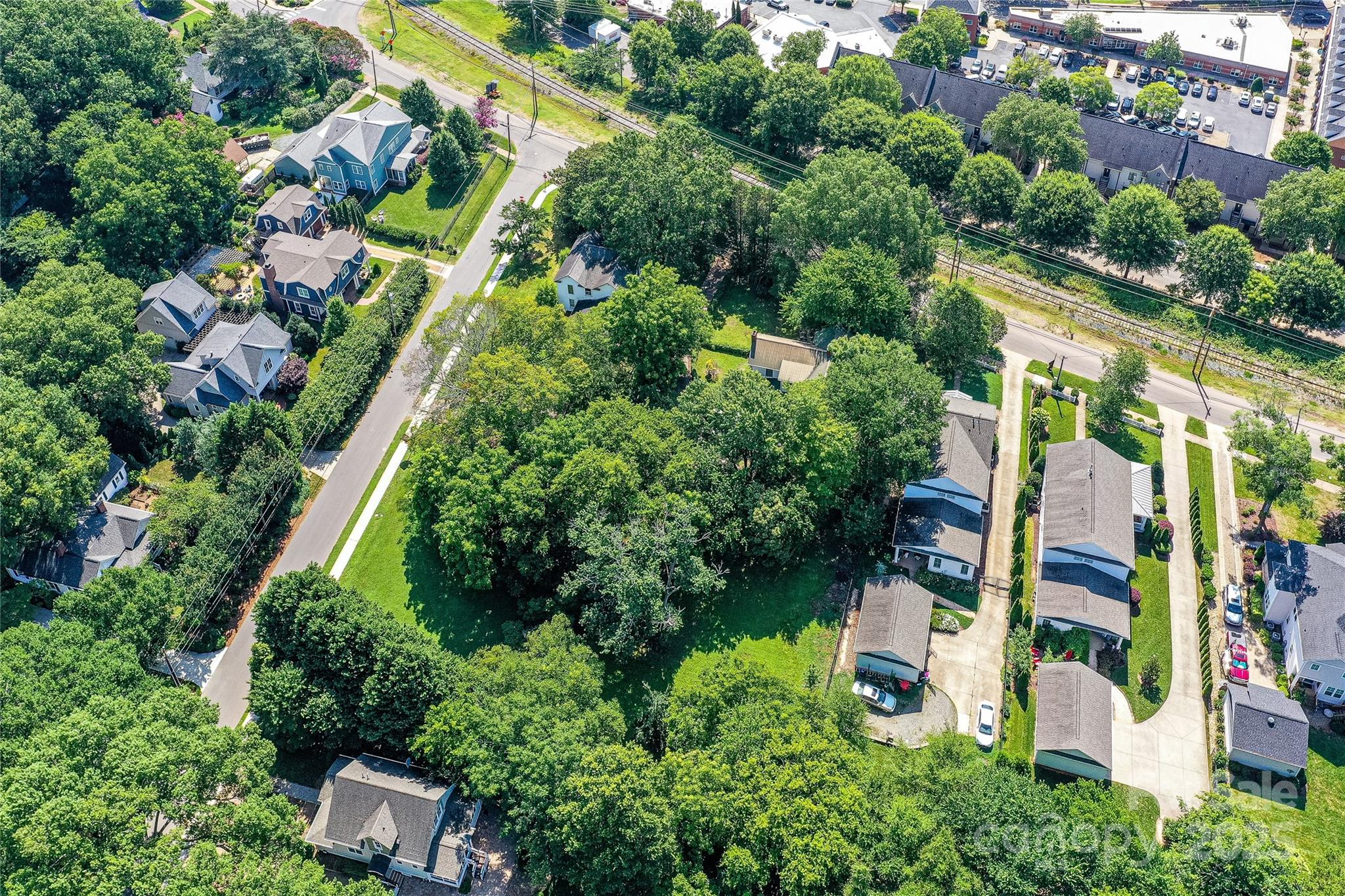 504 Potts Street Davidson, NC 28036 - Photo 30 of 34 an aerial view of residential house with outdoor space and trees all around