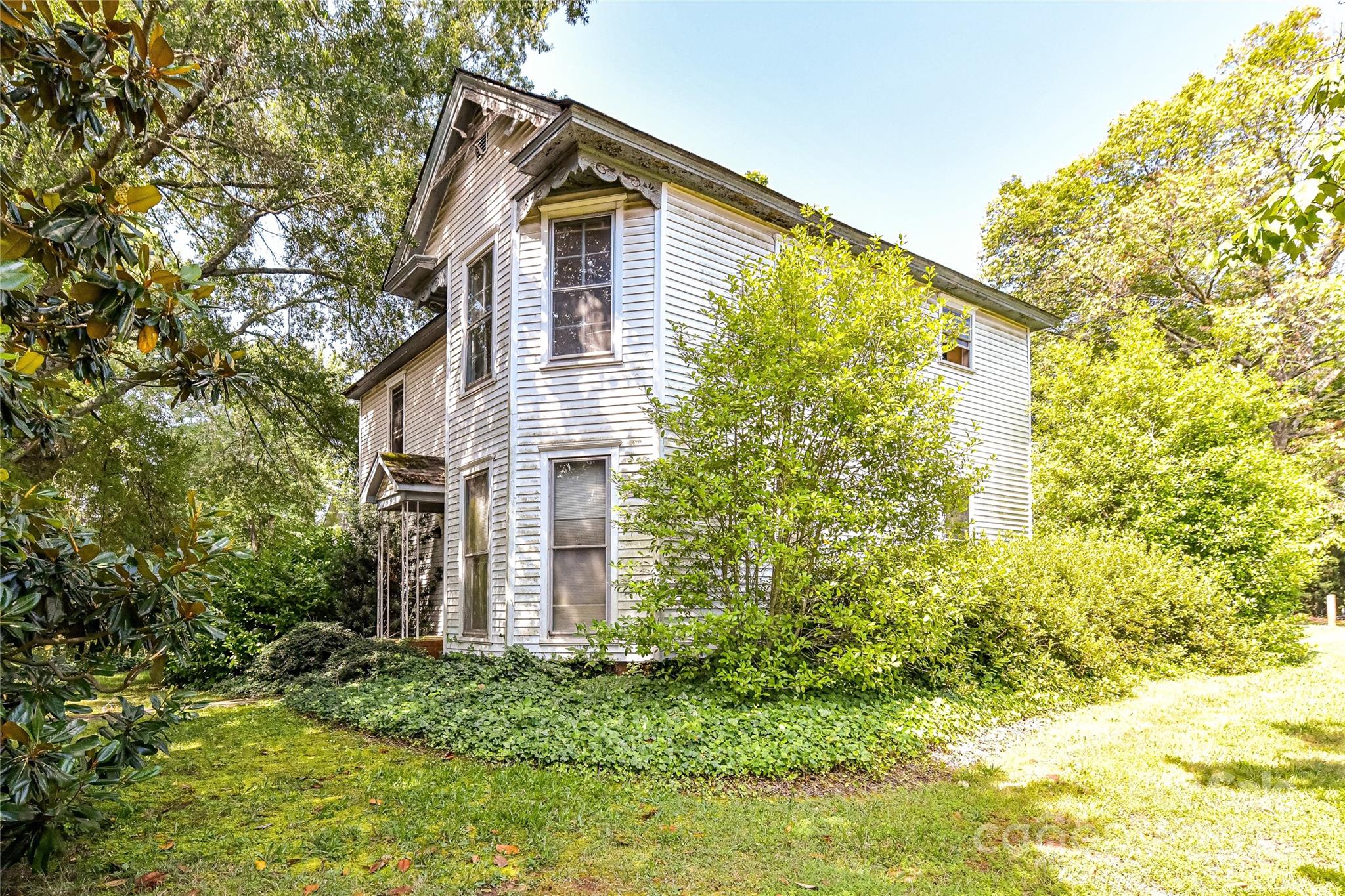 504 Potts Street Davidson, NC 28036 - Photo 5 of 34 a view of a house with a yard