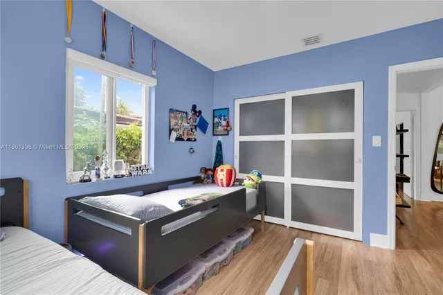 a room with a bed and a window