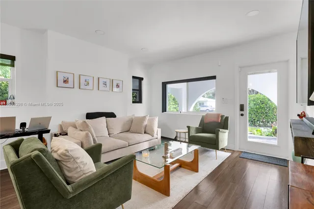 a living room with furniture and a window