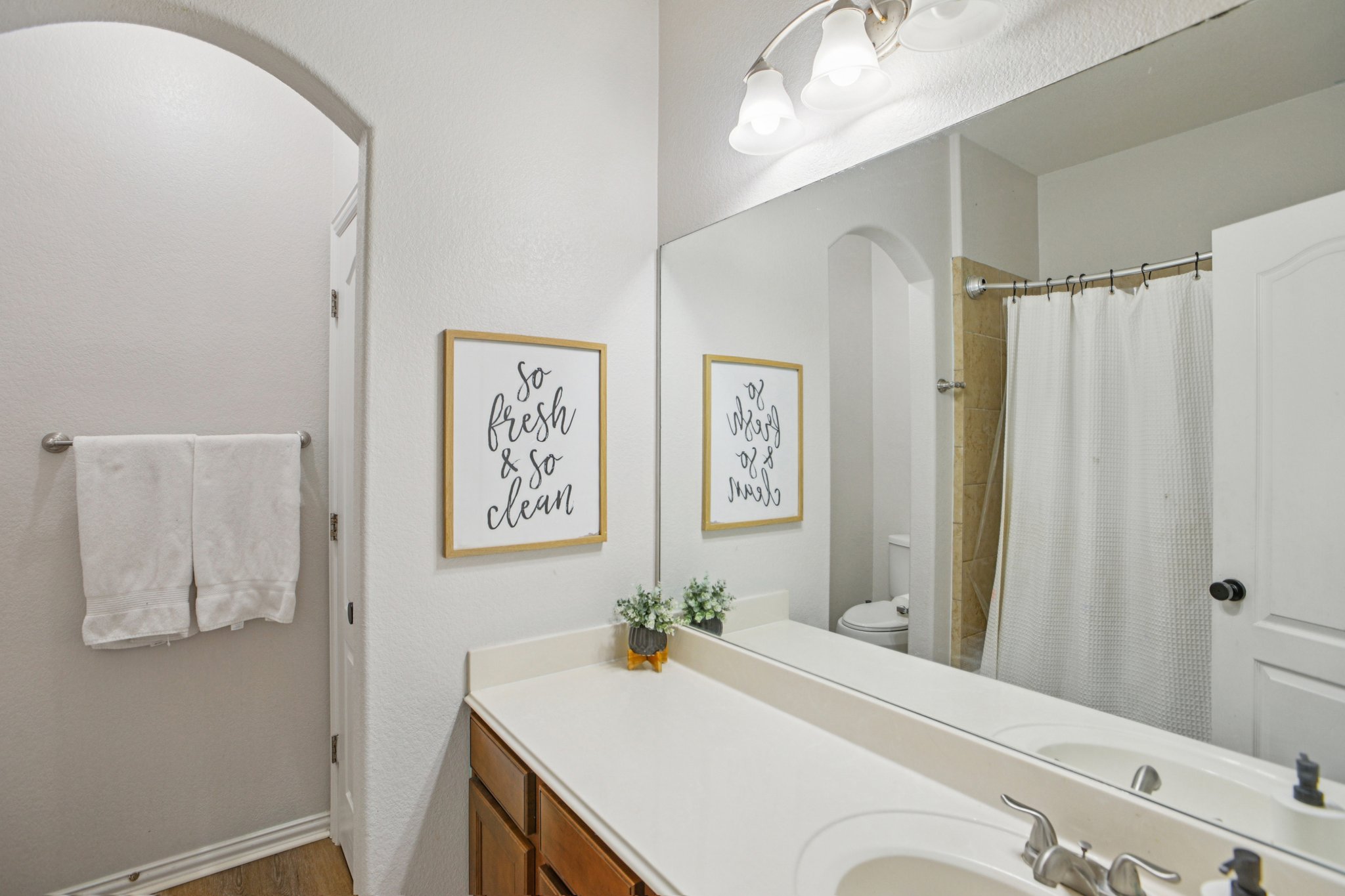 2308 Wind Vane West Pflugerville, TX 78660 - Photo 14 of 28 a bed room with a bed and a mirror