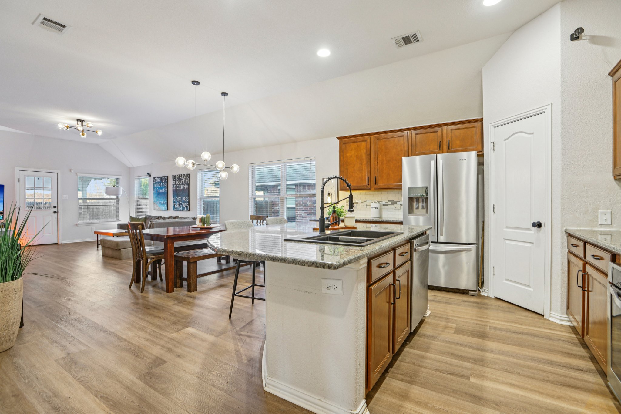 2308 Wind Vane West Pflugerville, TX 78660 - Photo 4 of 28 a kitchen with stainless steel appliances granite countertop a stove and a refrigerator