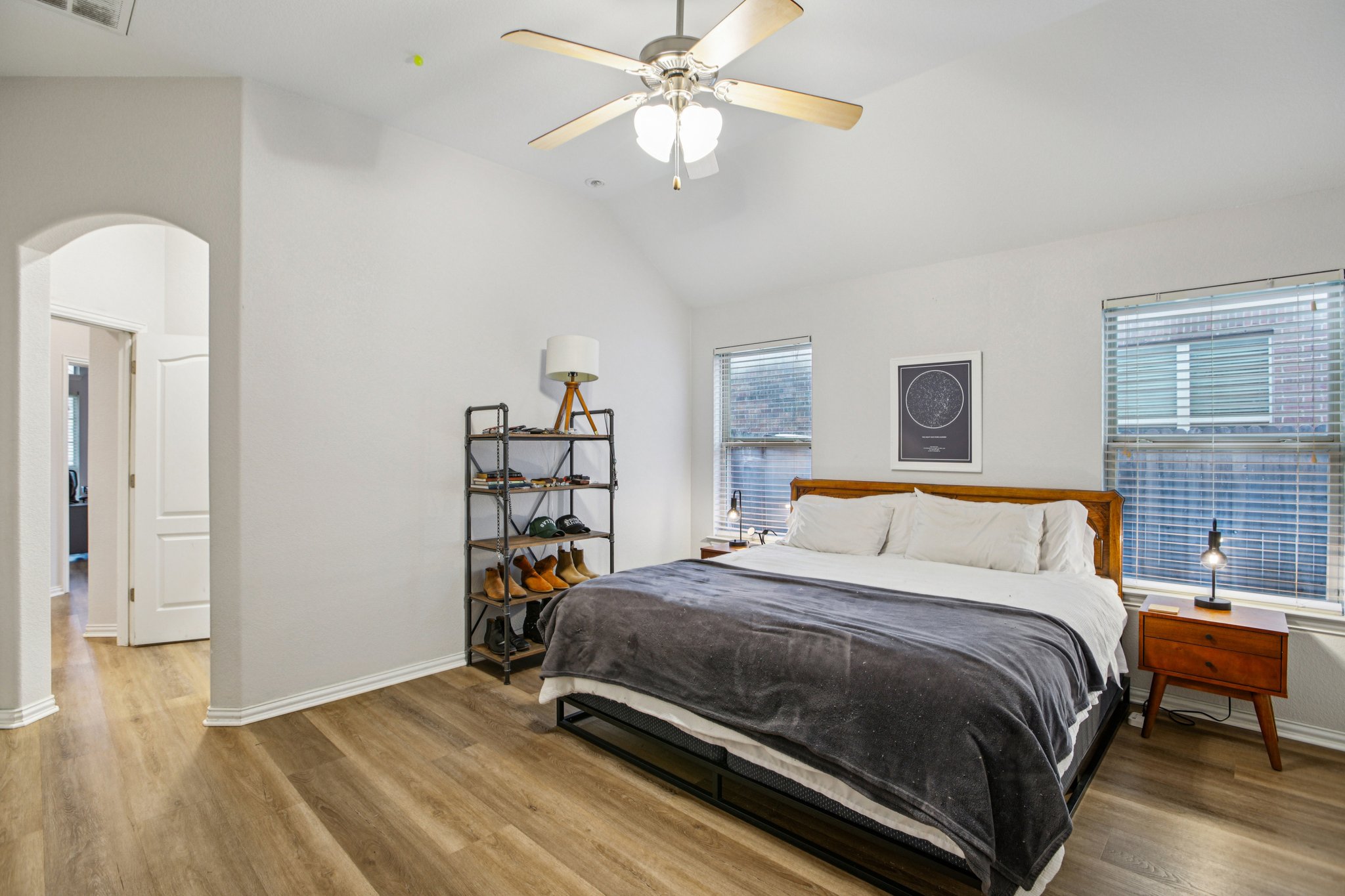 2308 Wind Vane West Pflugerville, TX 78660 - Photo 10 of 28 a bedroom with a bed and a chandelier