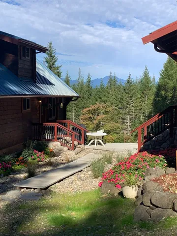 a view of a backyard with sitting area