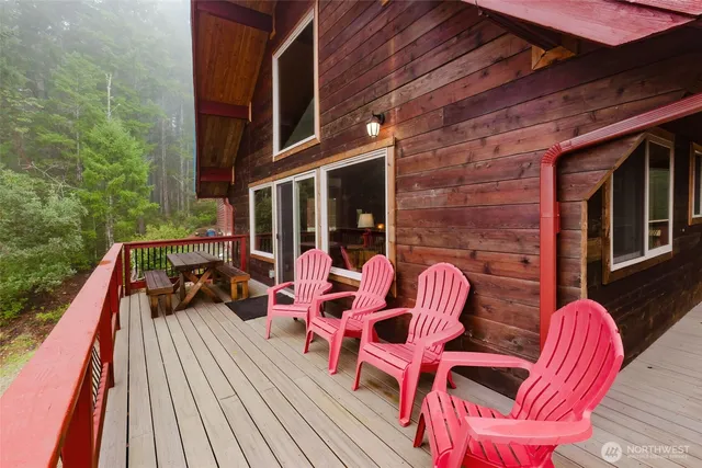 a view of balcony with wooden floor and outdoor seating