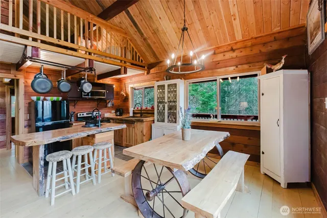 a view of a kitchen with a table and chairs