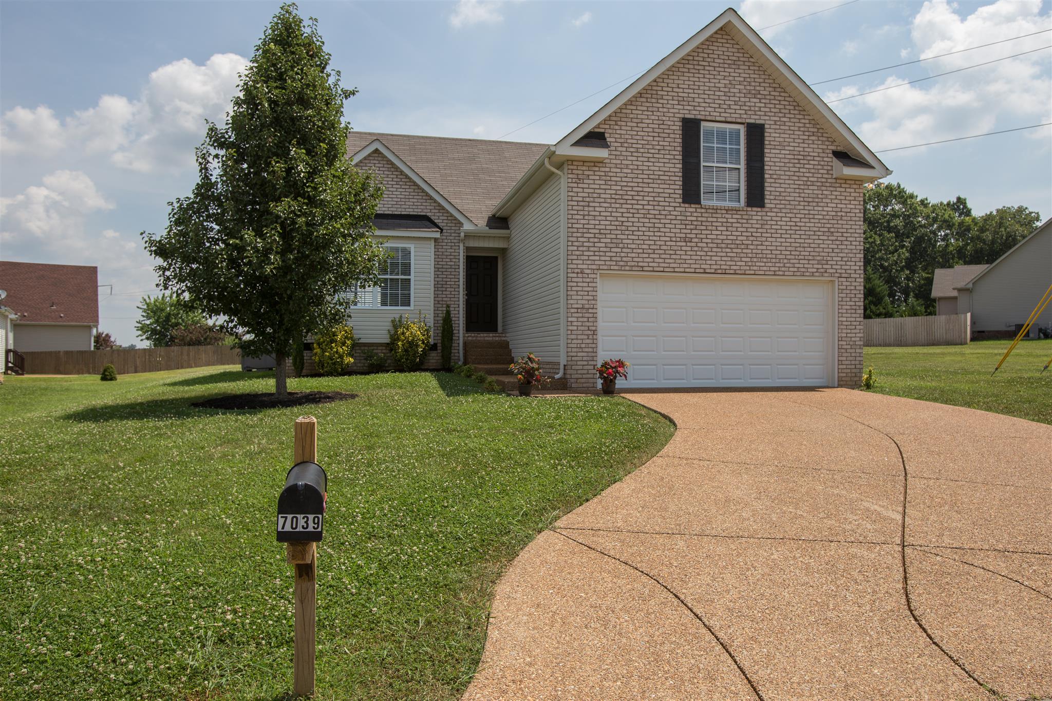 7039 Nickalus Way Spring Hill, TN 37174 - Photo 1 of 21 a front view of house with yard and green space