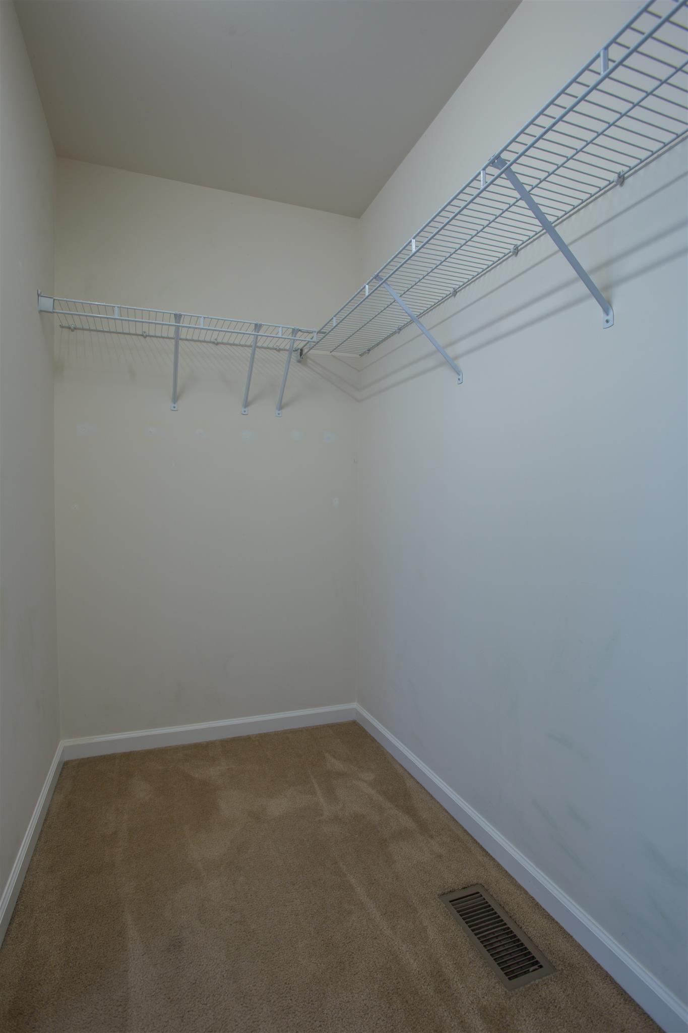 7039 Nickalus Way Spring Hill, TN 37174 - Photo 13 of 21 a view of a room with racks on the wall