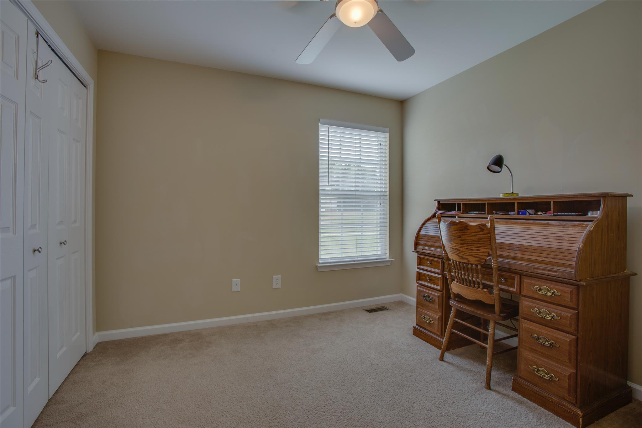 7039 Nickalus Way Spring Hill, TN 37174 - Photo 14 of 21 a room with a bunk bed and a window