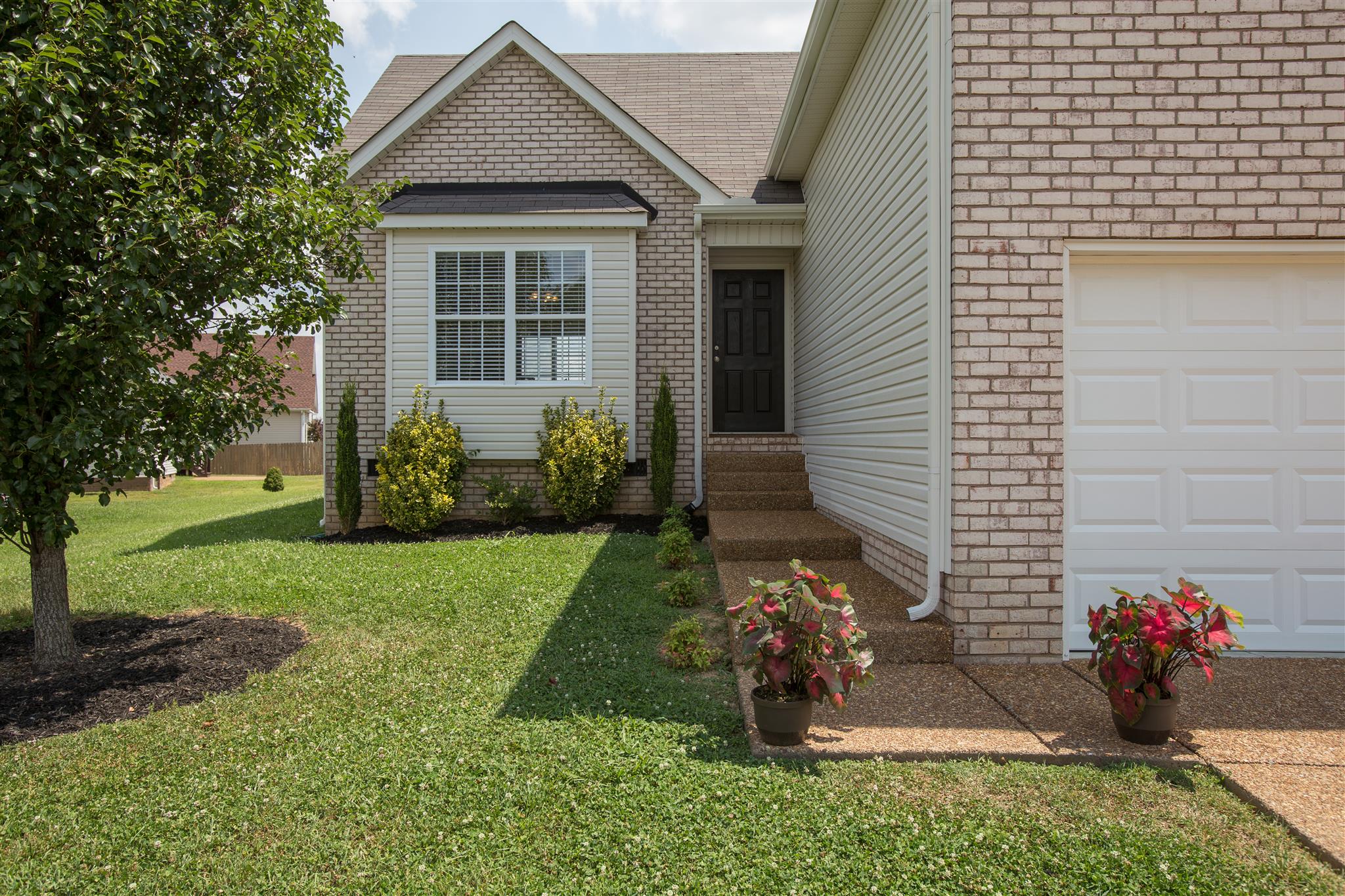 7039 Nickalus Way Spring Hill, TN 37174 - Photo 2 of 21 a front view of a house with a yard