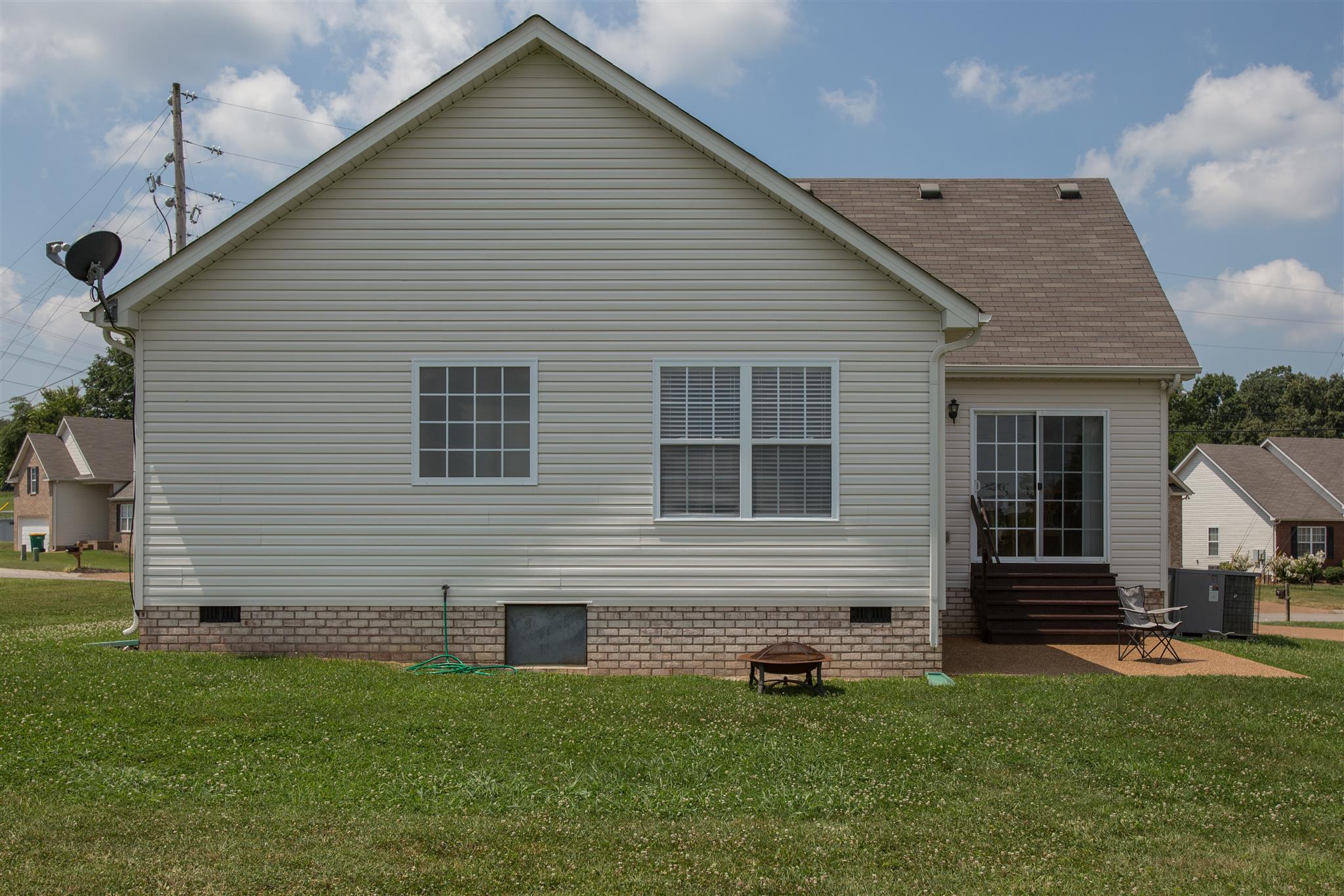 7039 Nickalus Way Spring Hill, TN 37174 - Photo 21 of 21 a front view of a house with a garden