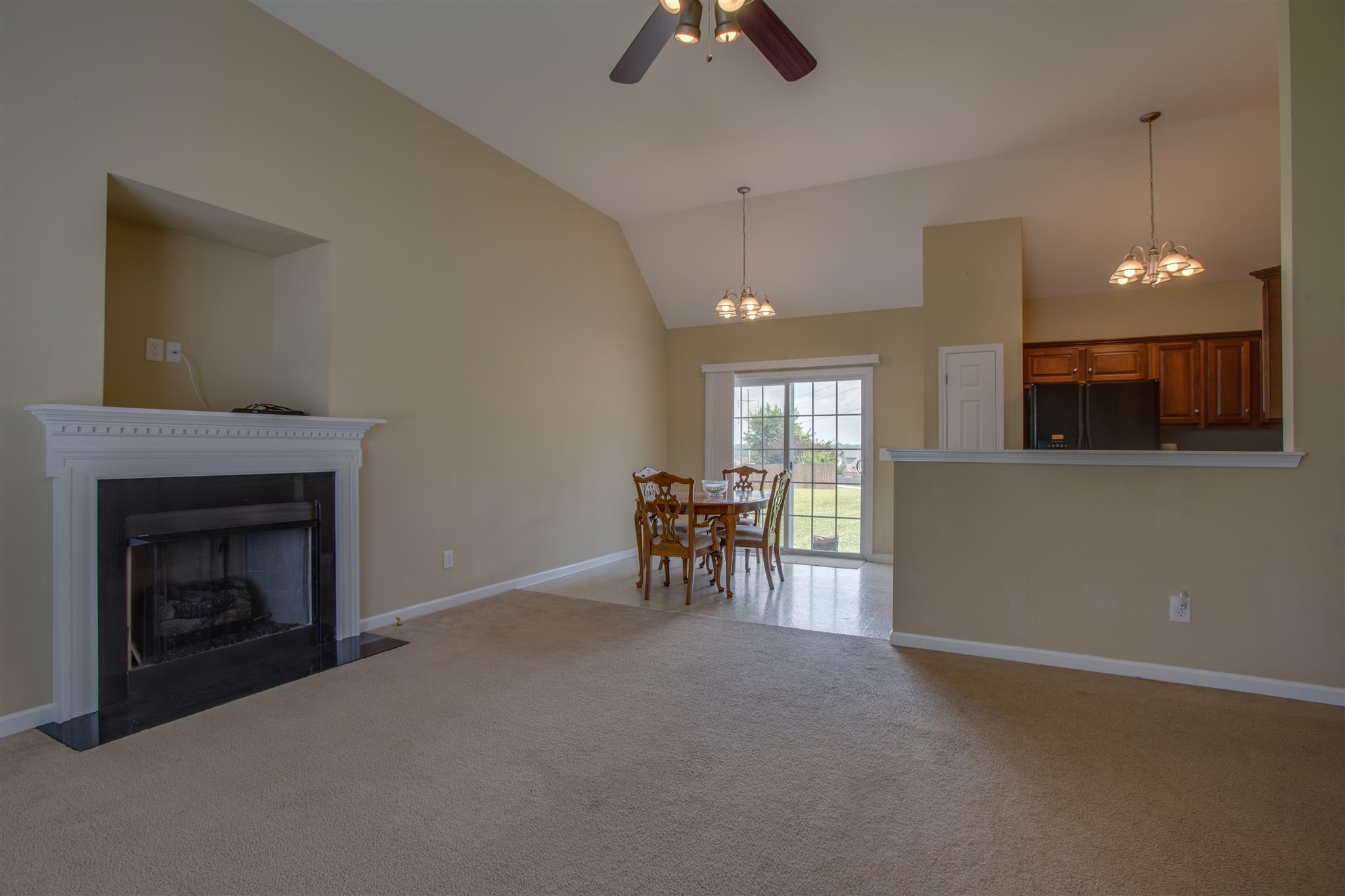 7039 Nickalus Way Spring Hill, TN 37174 - Photo 6 of 21 a view of a livingroom with furniture and a fireplace