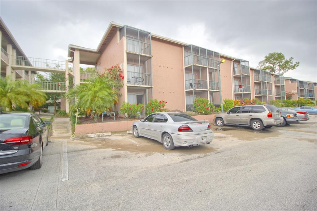 128 Water Front Way, Unit 300 Altamonte Springs, FL 32701 - Photo 1 of 1 a view of a cars park in front of a building