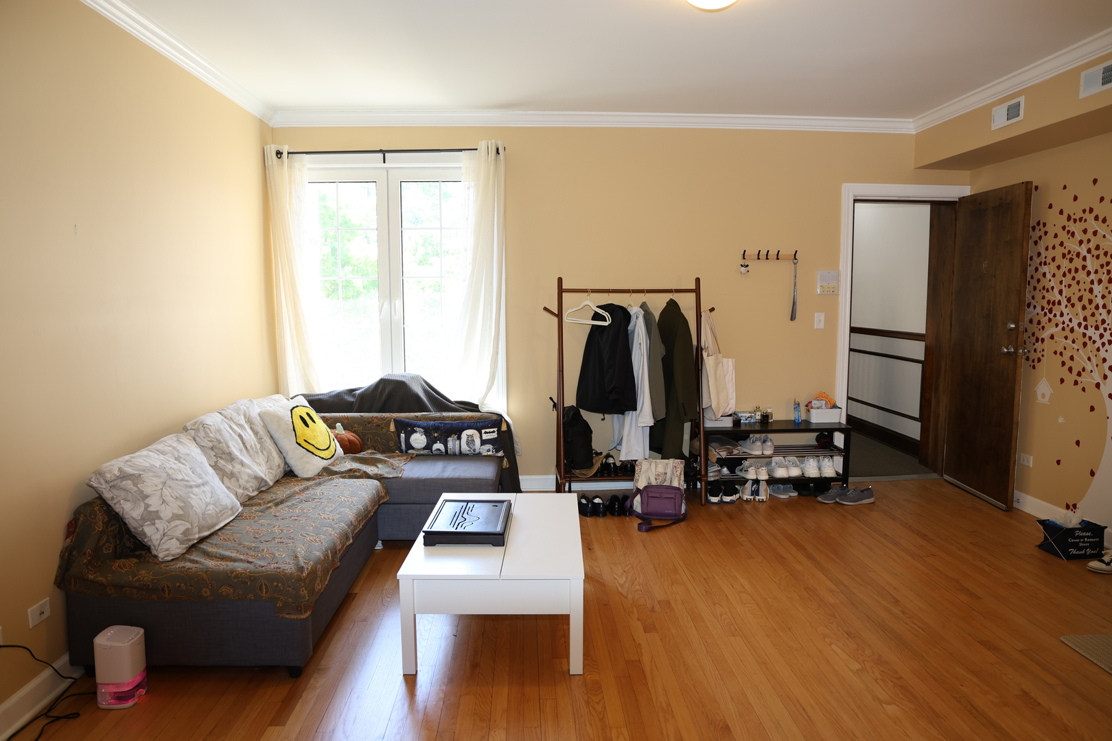 1615 Monroe Street, Unit 3N Evanston, IL 60202 - Photo 3 of 10 a living room with furniture a flat screen tv and a window