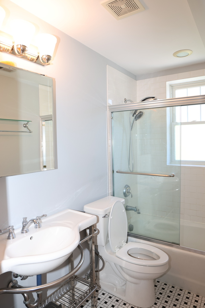1615 Monroe Street, Unit 3N Evanston, IL 60202 - Photo 7 of 10 a bathroom with a sink toilet and shower