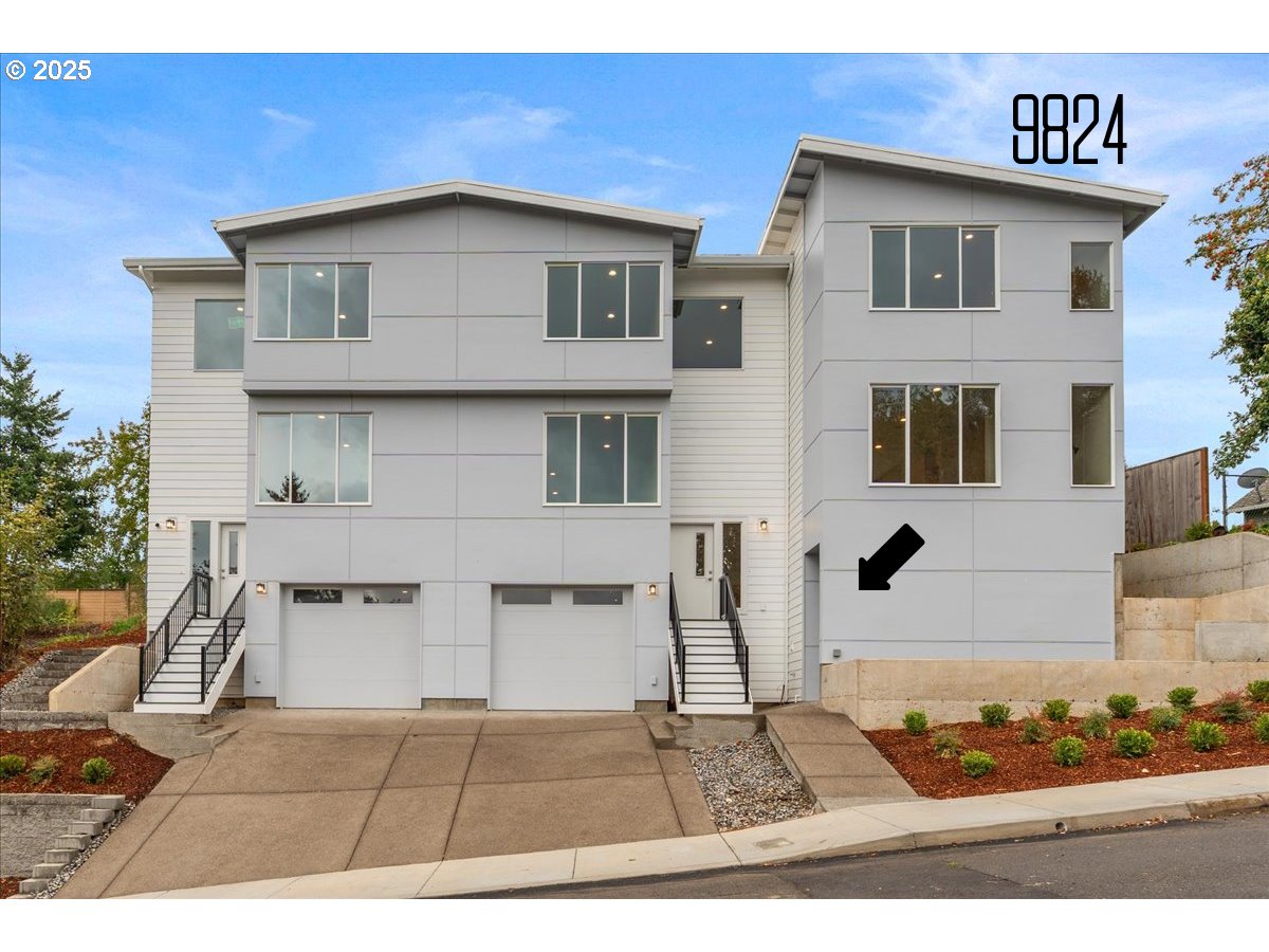 9824 Southwest 34th Place Portland, OR 97219 - Photo 1 of 19 a view of a house with wooden fence