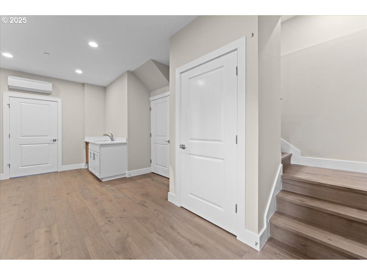 9824 Southwest 34th Place Portland, OR 97219 - Photo 12 of 19 a view of an empty room with wooden floor