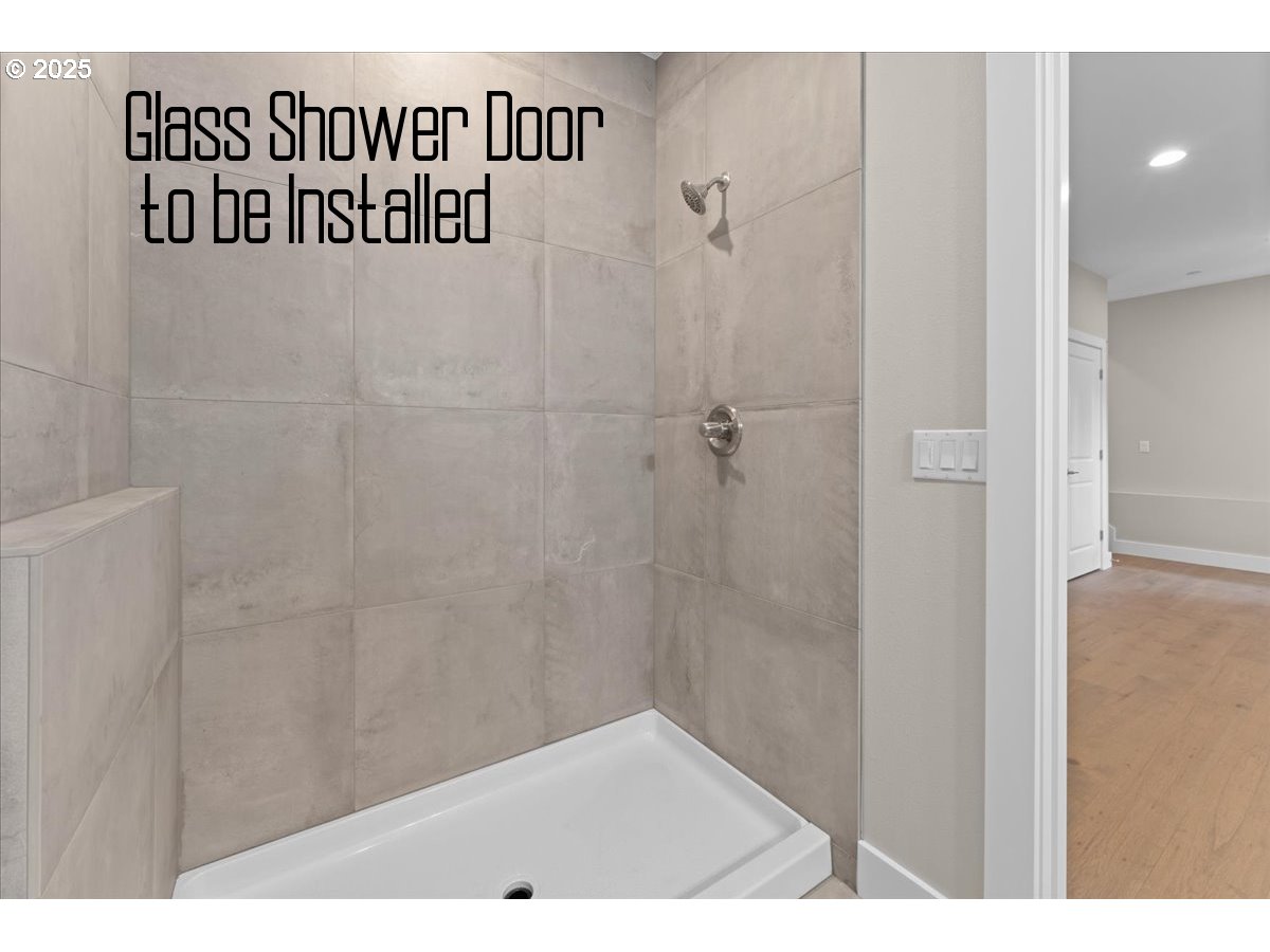 9824 Southwest 34th Place Portland, OR 97219 - Photo 15 of 19 a bathroom with a shower and a sink