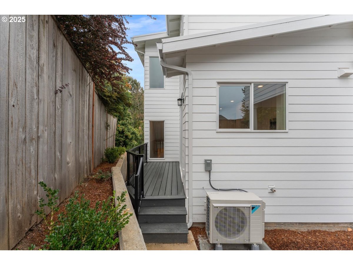 9824 Southwest 34th Place Portland, OR 97219 - Photo 16 of 19 a view of house with backyard and sitting area