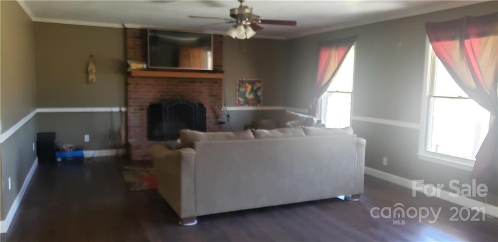 650 Monticello Road Lancaster, SC 29720 - Photo 2 of 25 a living room with furniture and a fireplace