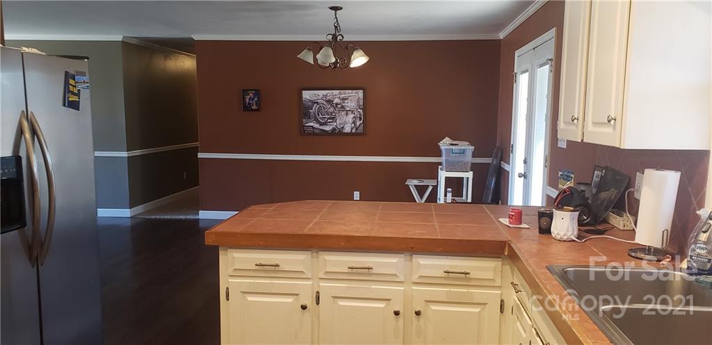 650 Monticello Road Lancaster, SC 29720 - Photo 8 of 25 a kitchen with stainless steel appliances a refrigerator and a stove