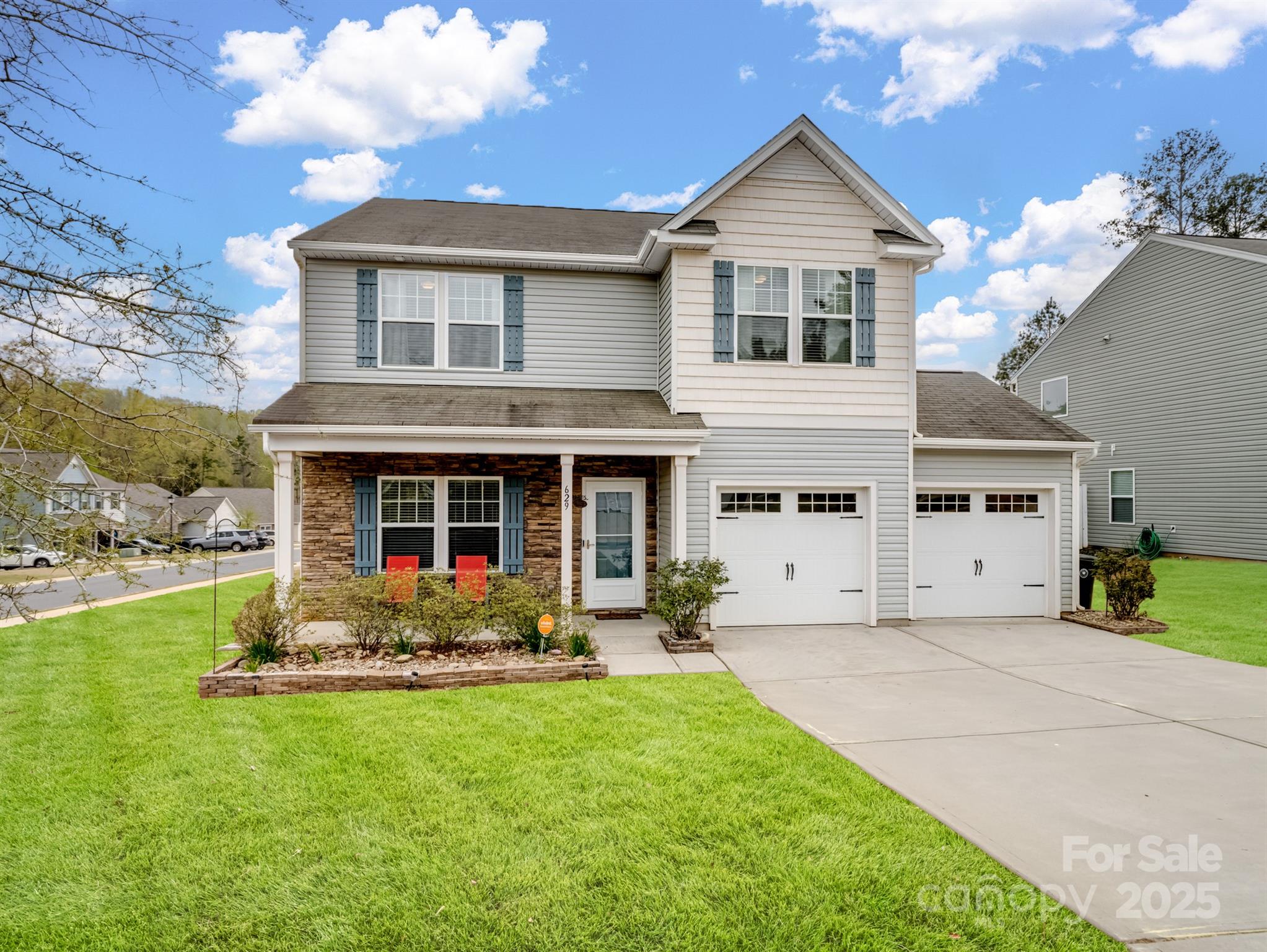 a front view of a house with garden