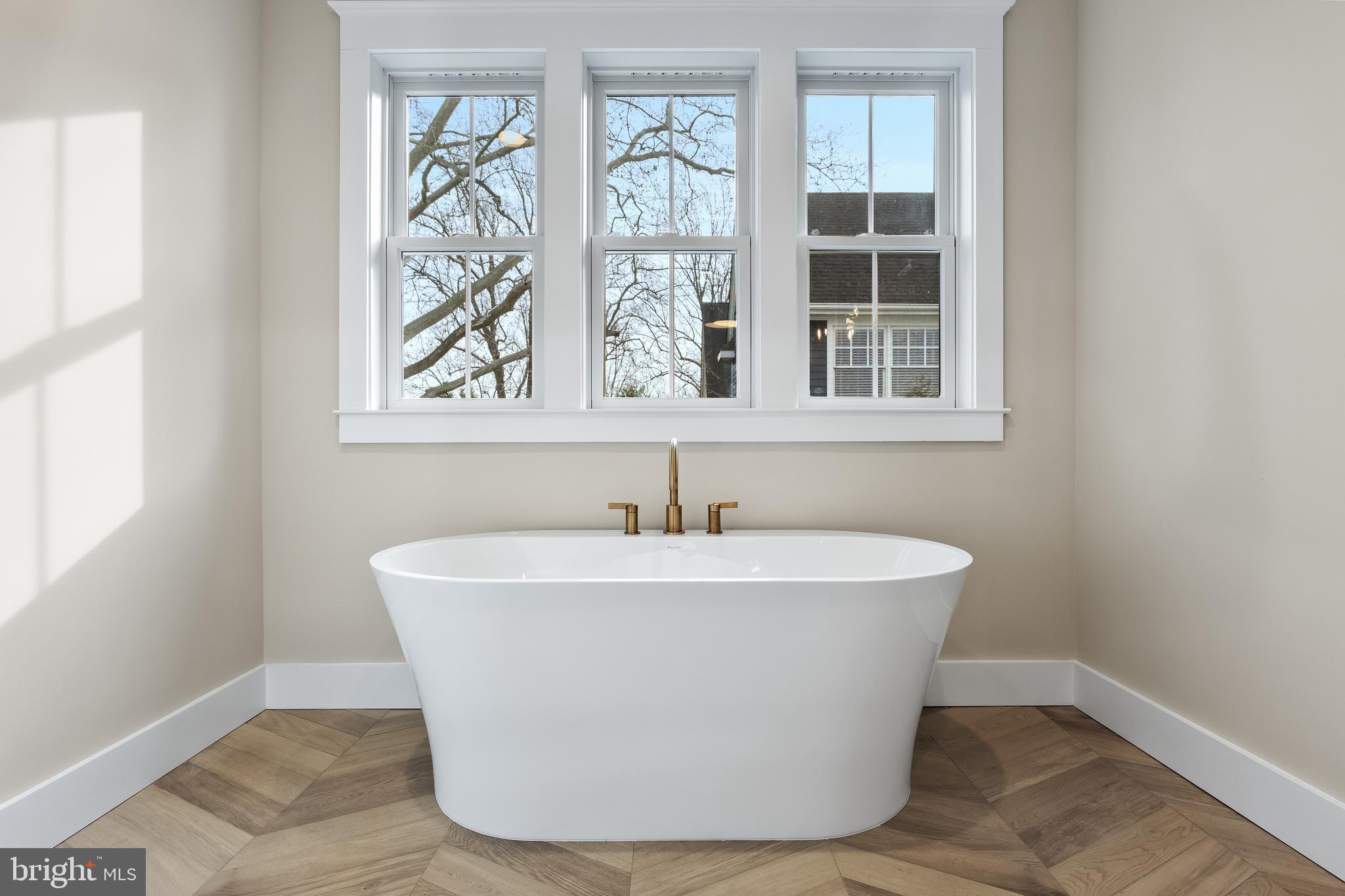 301 Centre Street Haddonfield, NJ 08033 - Photo 41 of 64 a white bath tub sitting next to a window