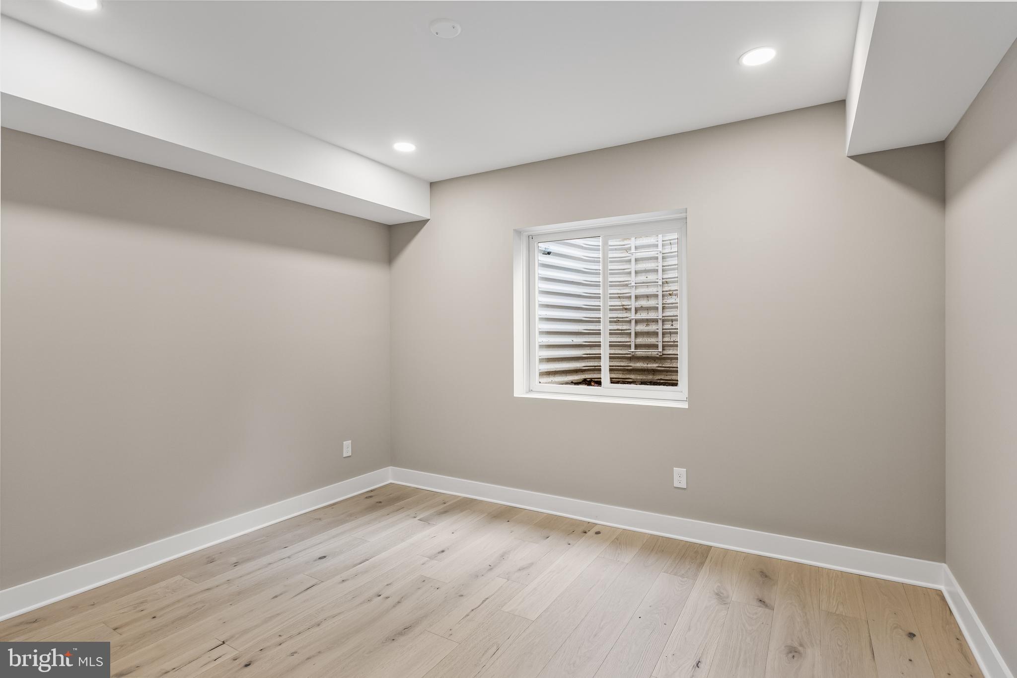 301 Centre Street Haddonfield, NJ 08033 - Photo 57 of 64 wooden floor in an empty room with a window