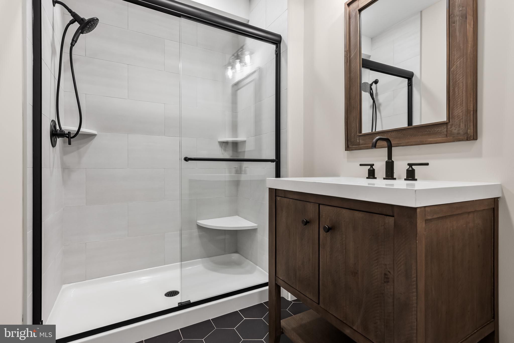 301 Centre Street Haddonfield, NJ 08033 - Photo 59 of 64 a bathroom with a double vanity sink mirror and shower