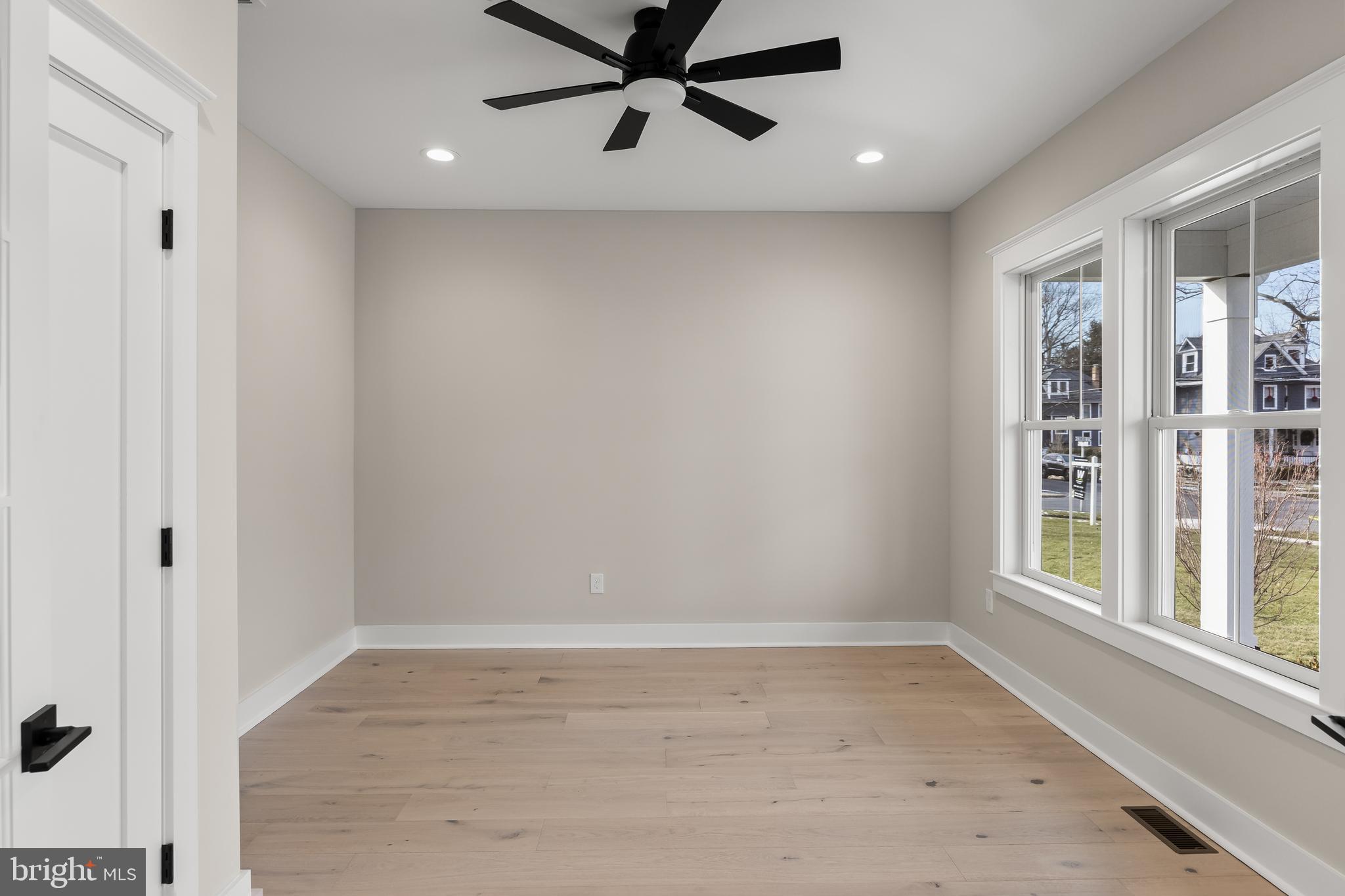 301 Centre Street Haddonfield, NJ 08033 - Photo 9 of 64 wooden floor in an empty room with a window