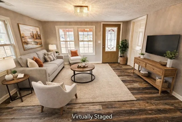 a view of a balcony with wooden floor and bench next to a yard