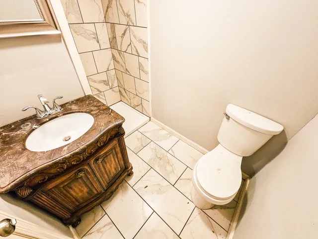 a kitchen with stainless steel appliances a refrigerator sink and microwave