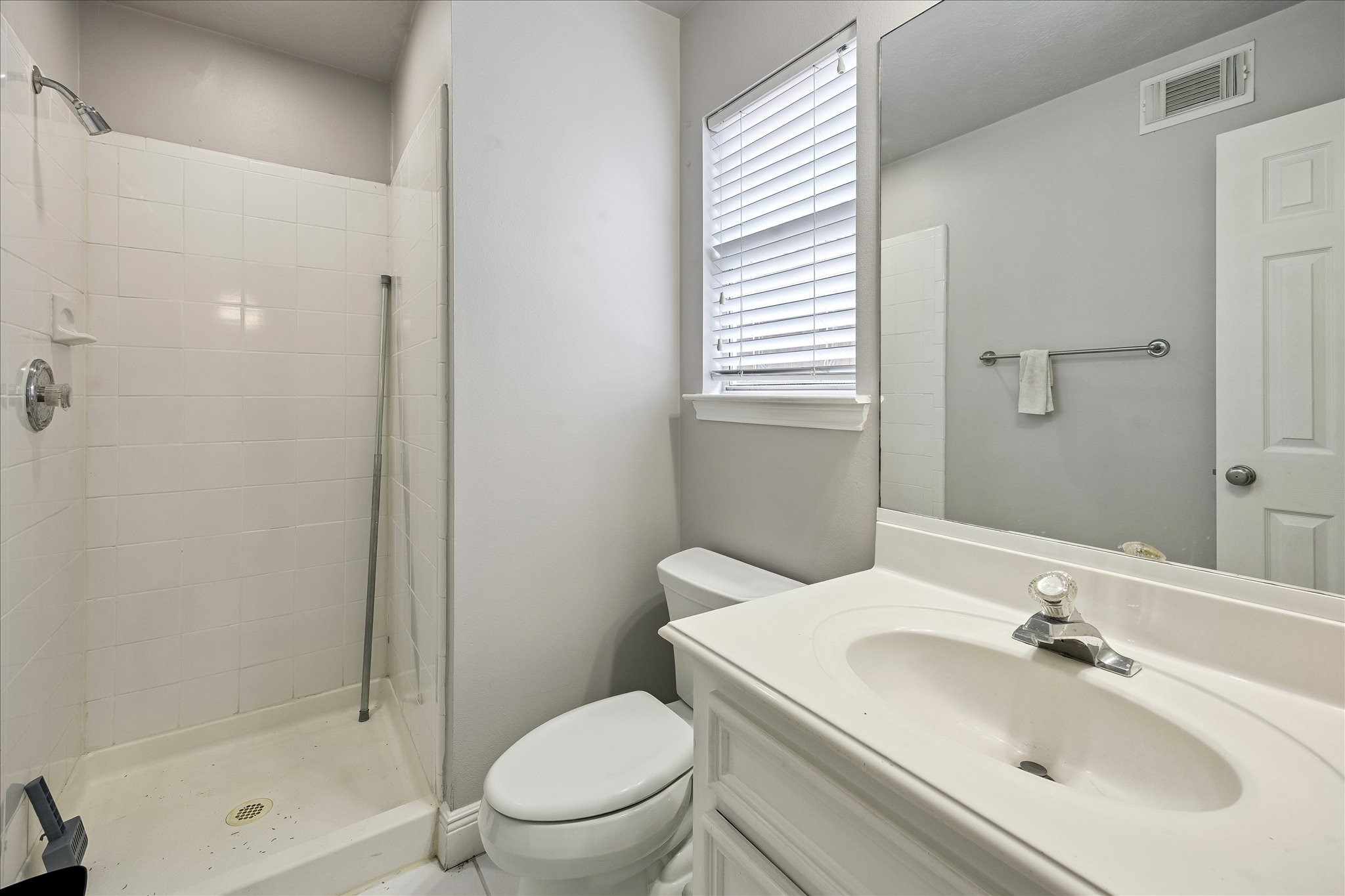 1304 Dart Street, Unit F Houston, TX 77007 - Photo 13 of 13 a bathroom with a sink toilet and shower