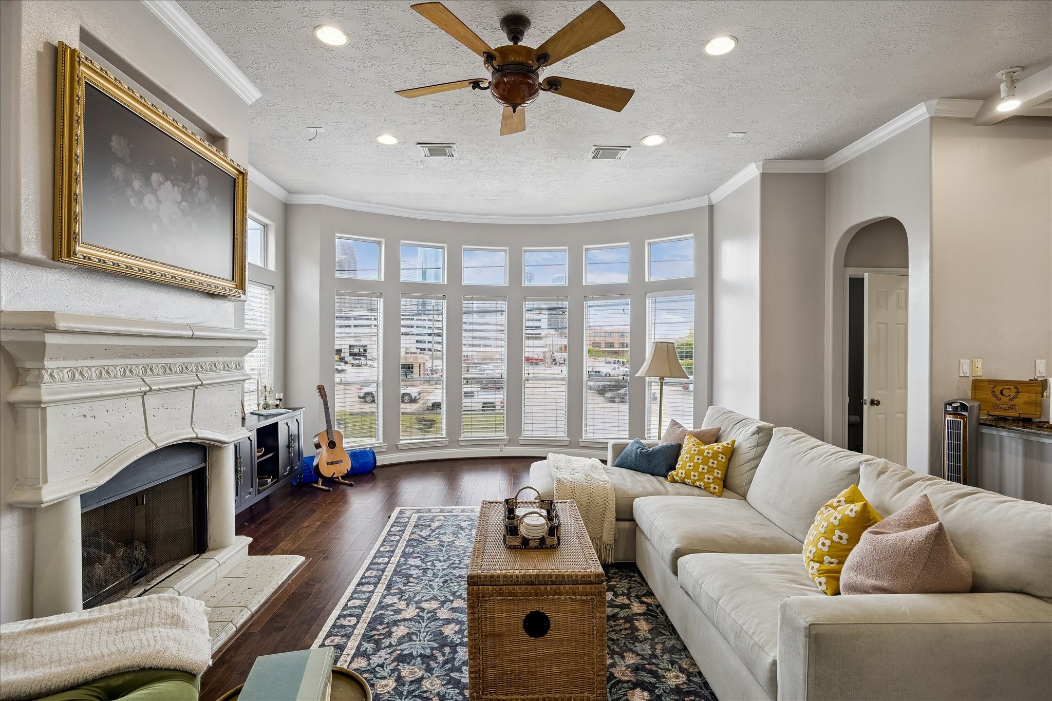 1304 Dart Street, Unit F Houston, TX 77007 - Photo 3 of 13 a living room with furniture a fireplace and a floor to ceiling window