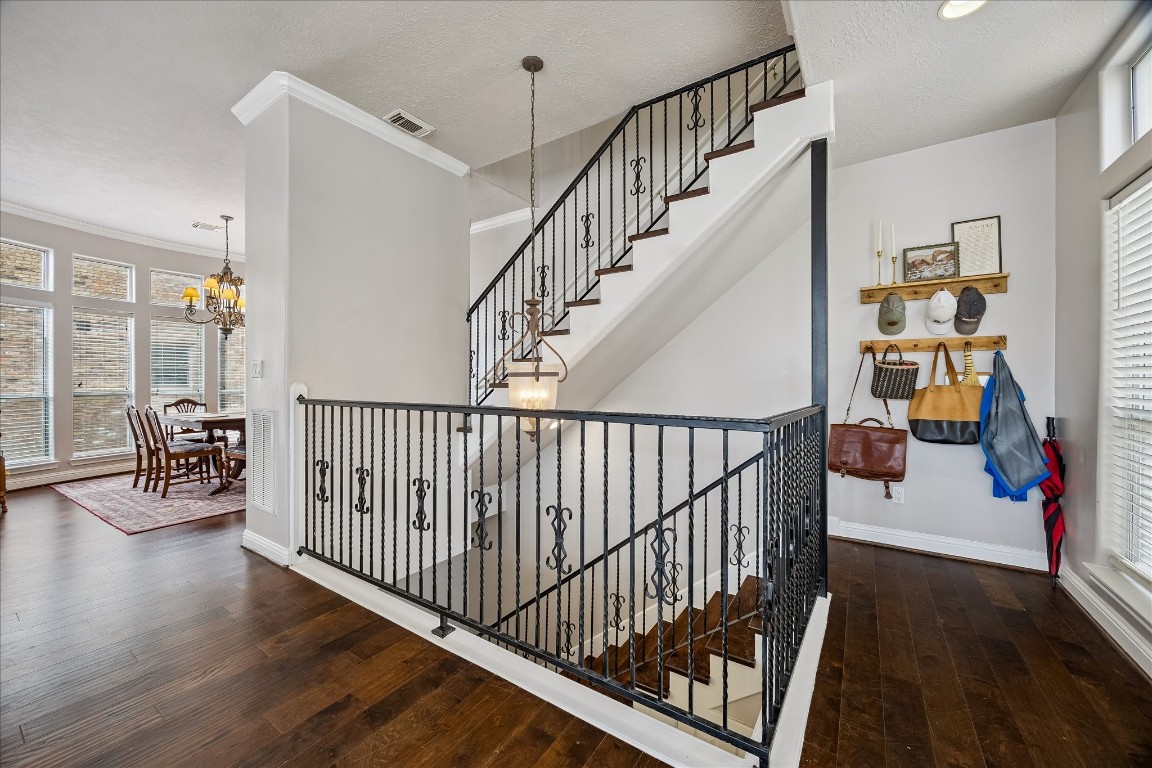 1304 Dart Street, Unit F Houston, TX 77007 - Photo 8 of 13 a view of entryway with wooden floor and stairs