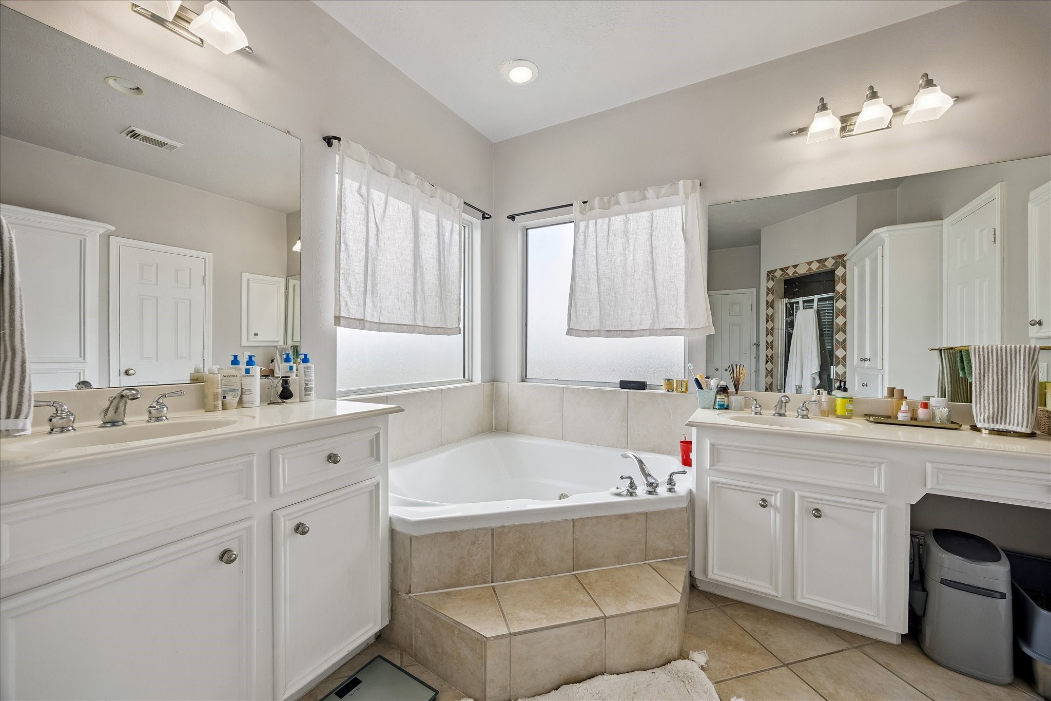 1304 Dart Street, Unit F Houston, TX 77007 - Photo 10 of 13 a bathroom with a tub sink and mirror