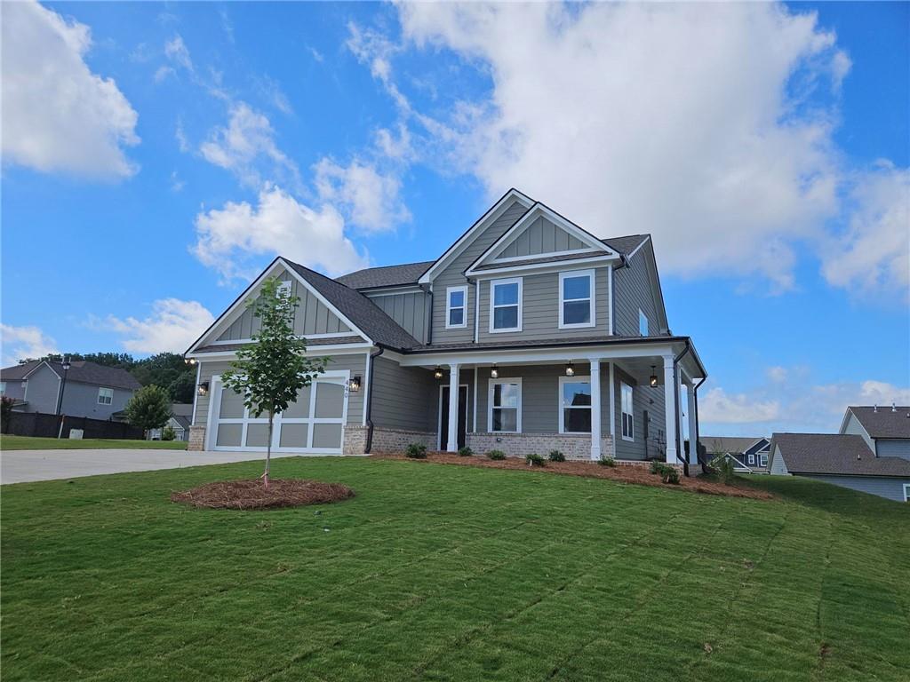 440 Banff Drive Winder, GA 30680 - Photo 3 of 18 a front view of a house with a yard