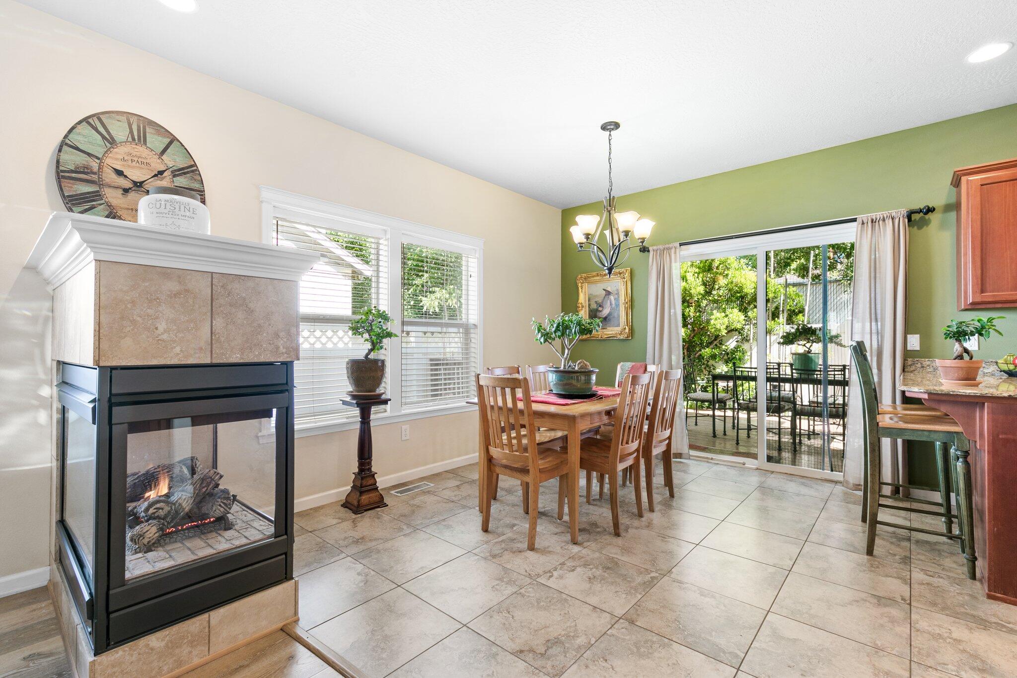 2160 Crestbrook Road Medford, OR 97504 - Photo 7 of 26 Triple-sided fireplace between living room and dining
