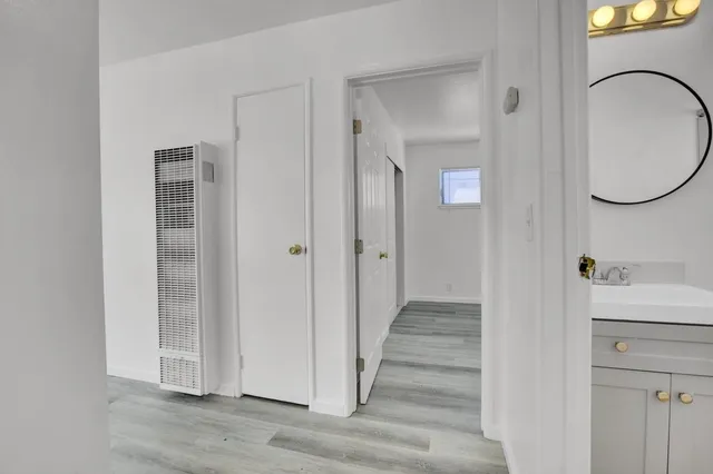 a view of a bathroom from the hallway