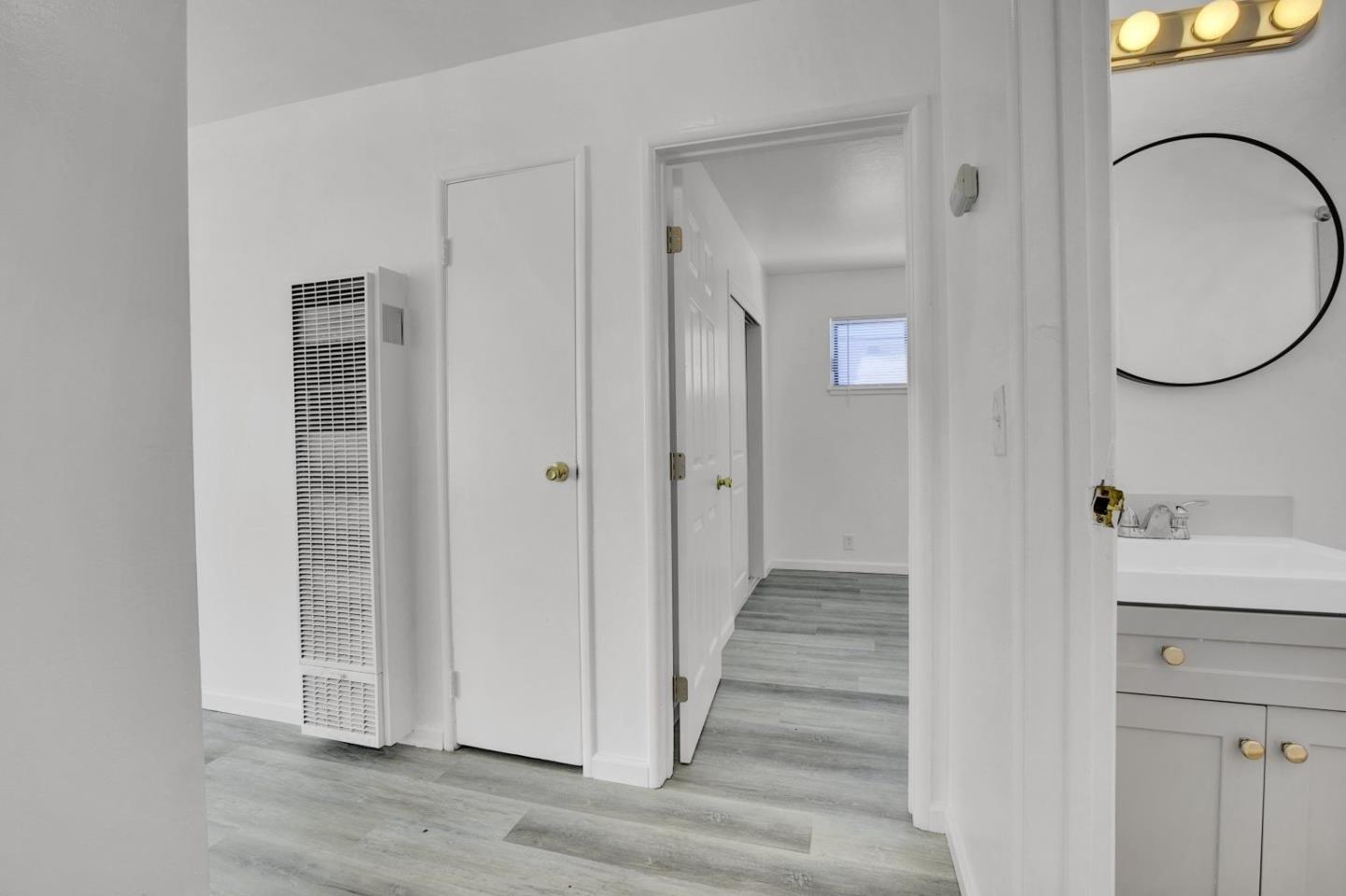 8811 A Street Oakland, CA 94621 - Photo 13 of 30 a view of a bathroom from the hallway